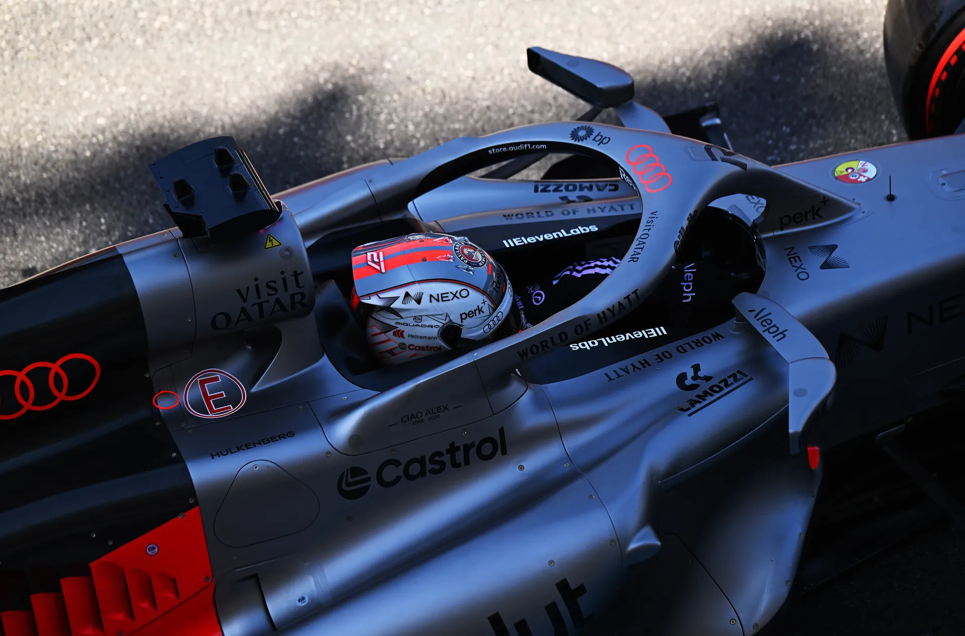 Top view of Nico Hulkenberg in Audi Revolut F1® Team car with orange helmet visible in cockpit