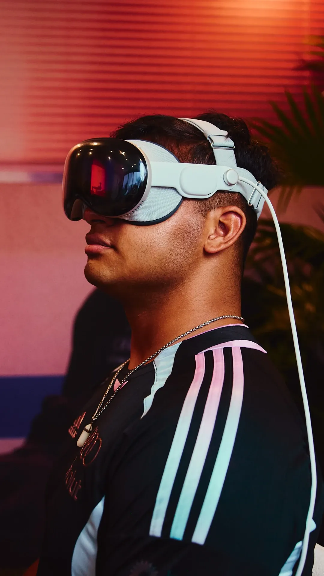 Guest wearing a virtual reality headset experiencing an immersive activation at the Audi Revolut F1® Team event