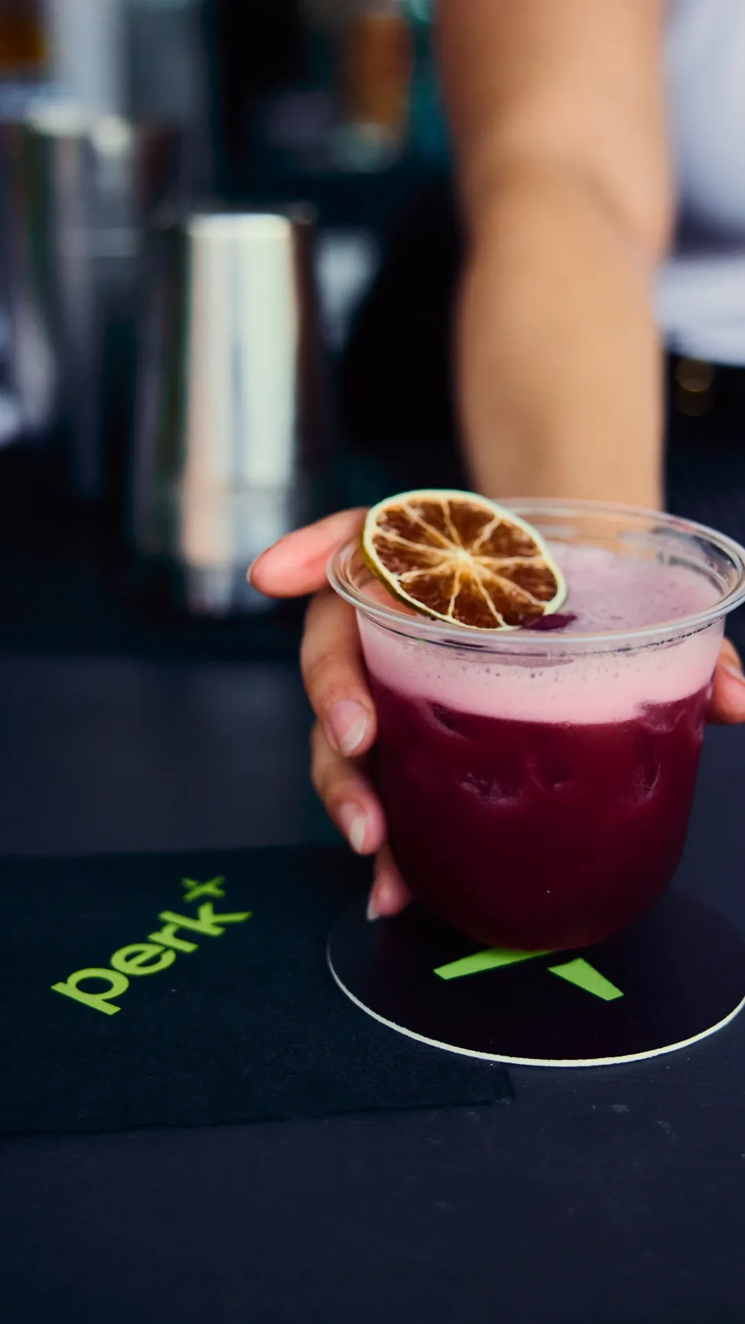 Close-up of a cocktail served at the MAPS backlot activation with citrus garnish on top