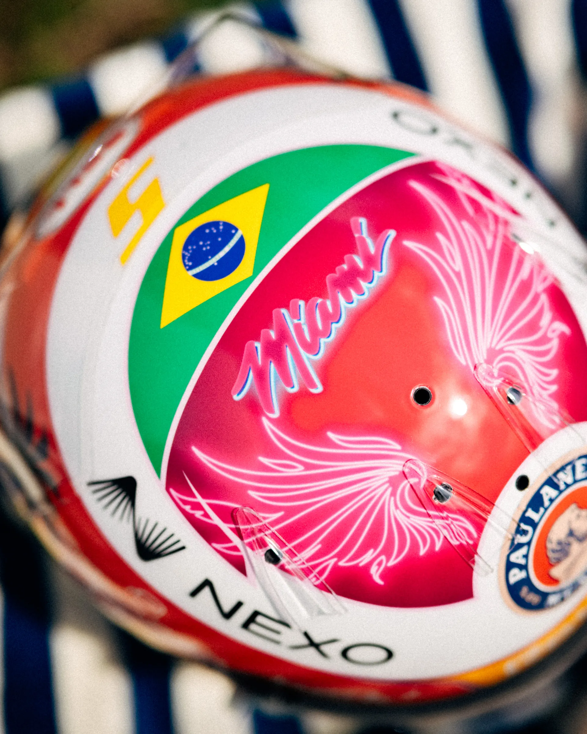 Close up of the crown of Gabriel Bortoleto’s special Miami edition race helmet, highlighting the Brazil flag and pink Miami script artwork.