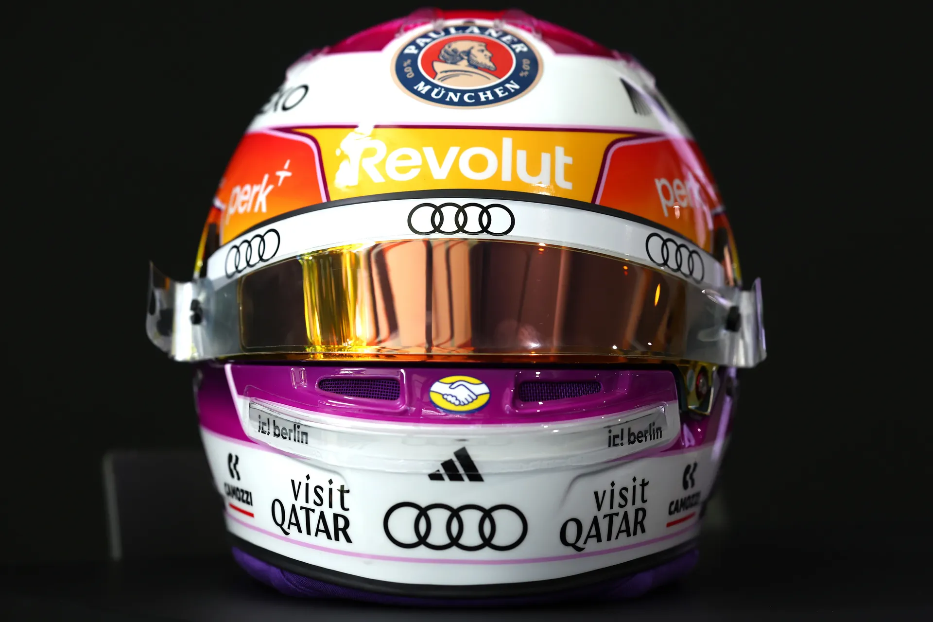 Front view of Gabriel Bortoleto’s Miami special helmet for Audi Revolut F1® Team, with reflective visor and sponsor logos including Audi, Revolut, and Visit Qatar.