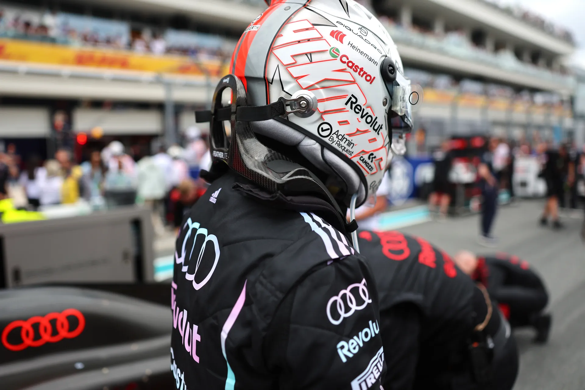 Audi Revolut F1® Team driver Nico Hulkenberg in full helmet prepares in the Miami pit lane during the 2026 Grand Prix weekend.