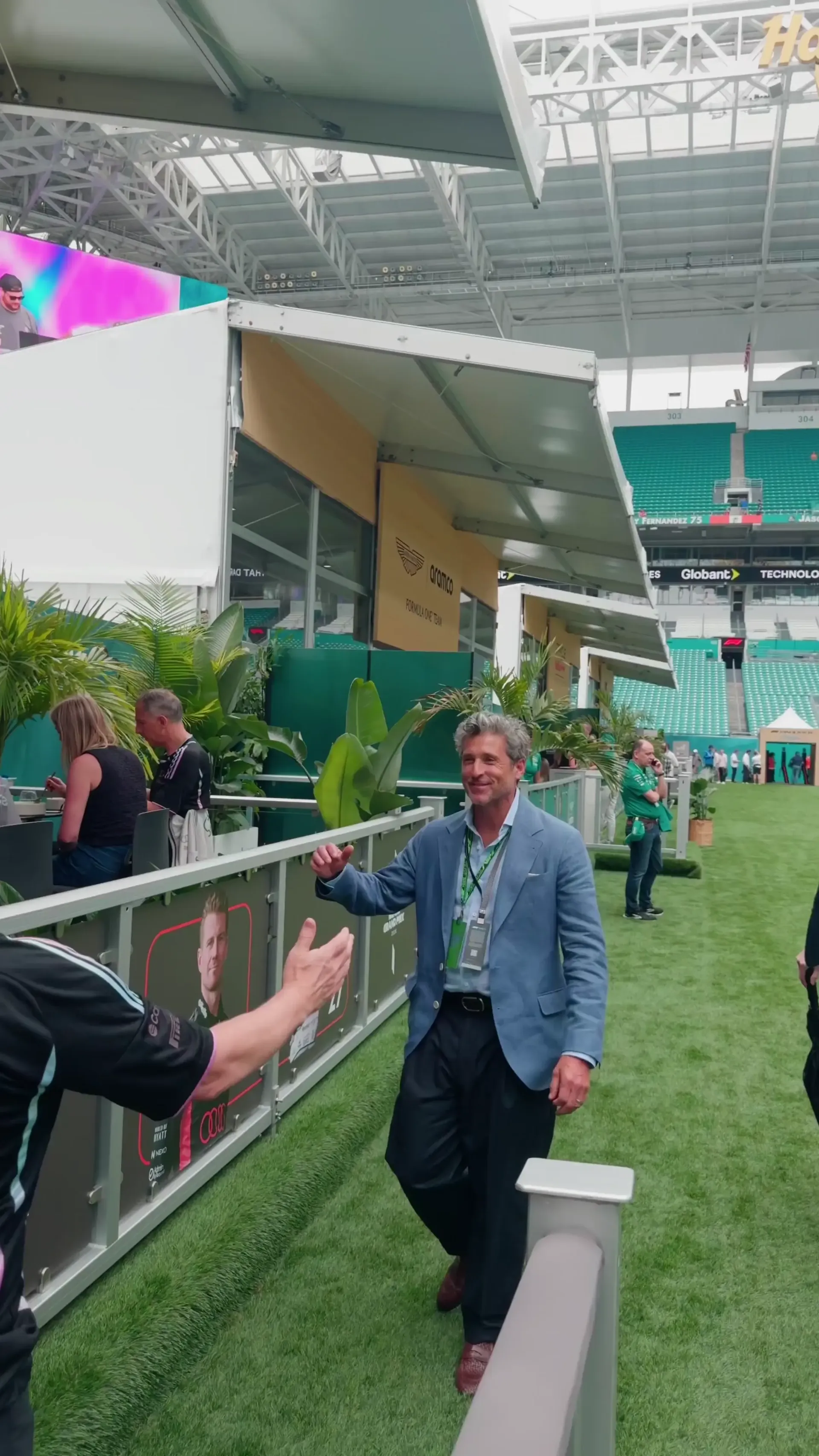 Allan McNish and Patrick Dempsey in conversation at the Audi Revolut F1® Team paddock during the Miami Grand Prix weekend.