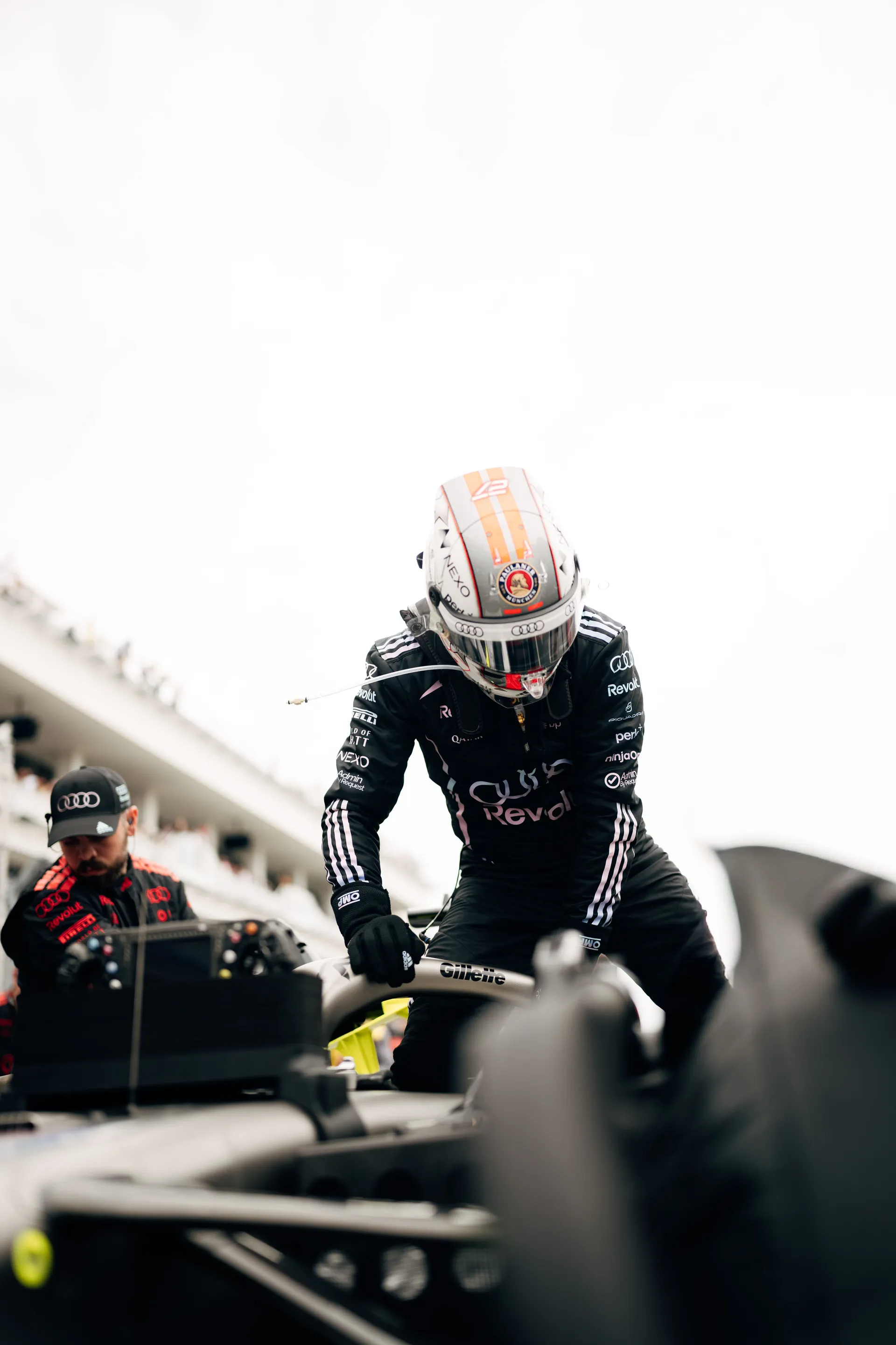 Audi Revolut F1® Team Nico Hulkenberg climbs out of the cockpit of the R26 car in the Miami paddock during the 2026 Miami Grand Prix weekend.