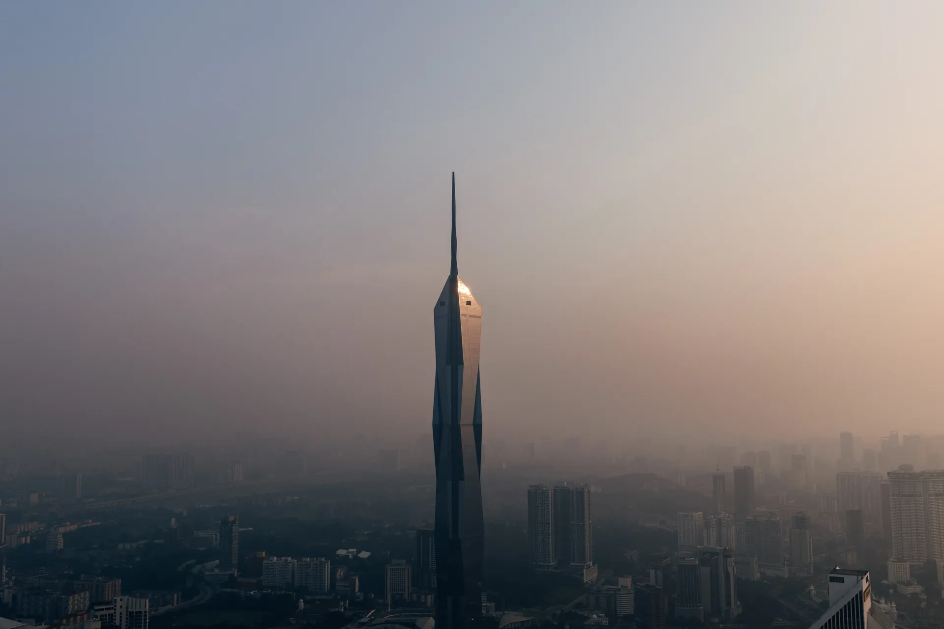 Merdeka 118 rising above the hazy Kuala Lumpur skyline