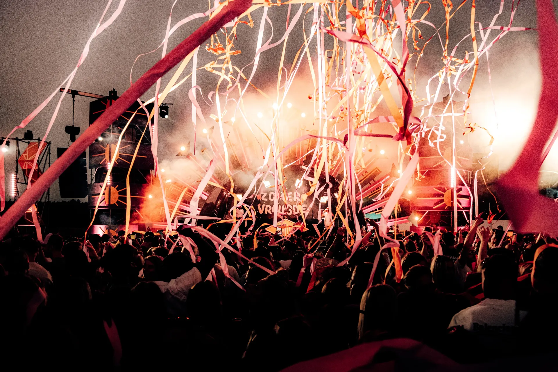 Festival stage with streamers and lights at night, "Zomervreugde" sign — Audi Revolut F1 Team Dutch GP race week party