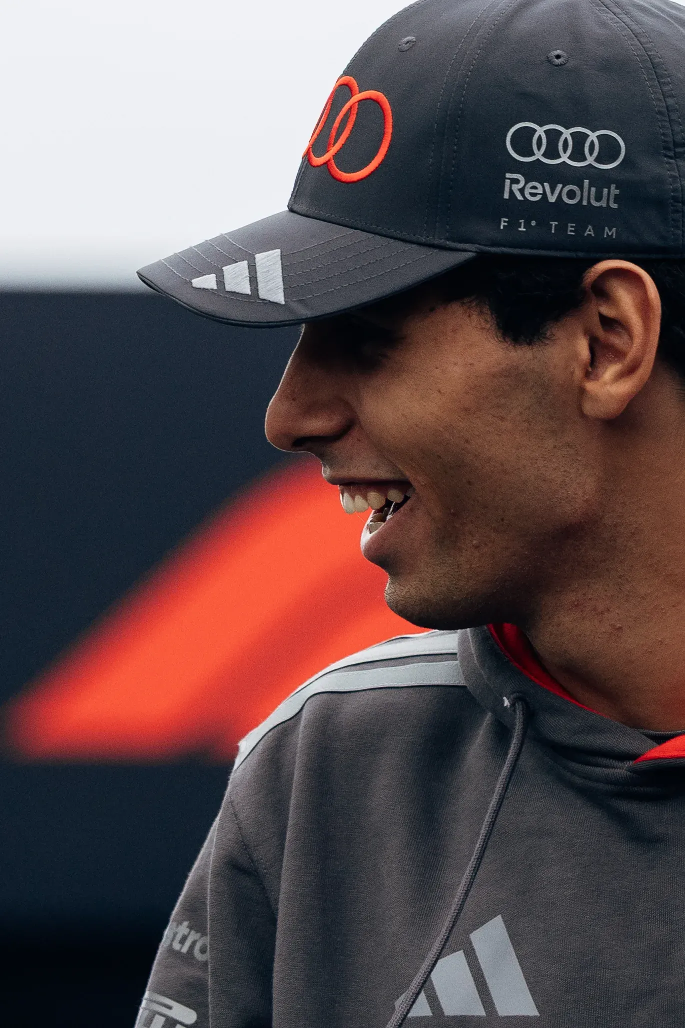 Close-up of Gabriel Bortoleto smiling in Audi Revolut F1® Team cap at Zandvoort