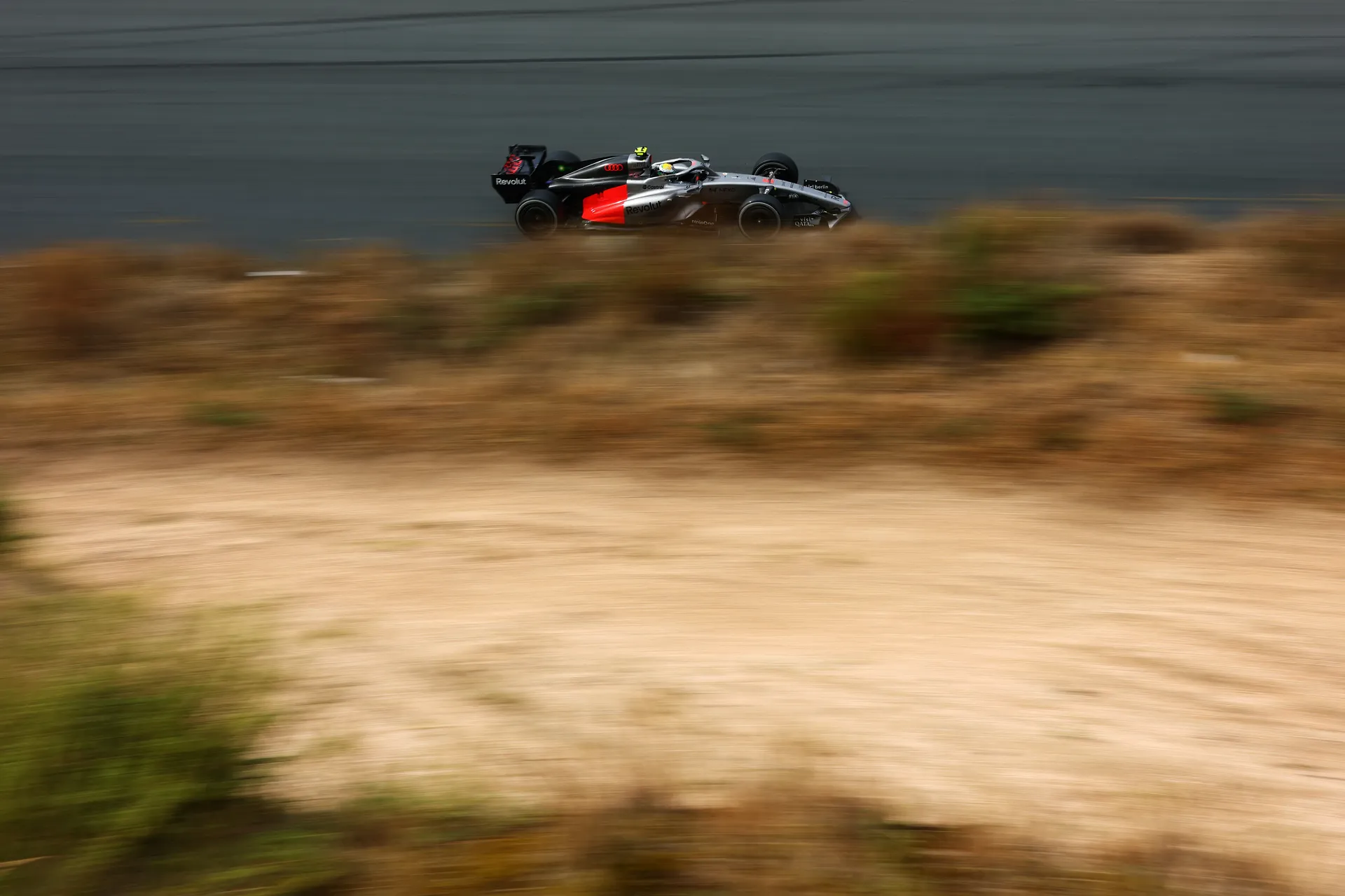 Audi Revolut F1® Team car passing the Zandvoort dunes in a panning shot