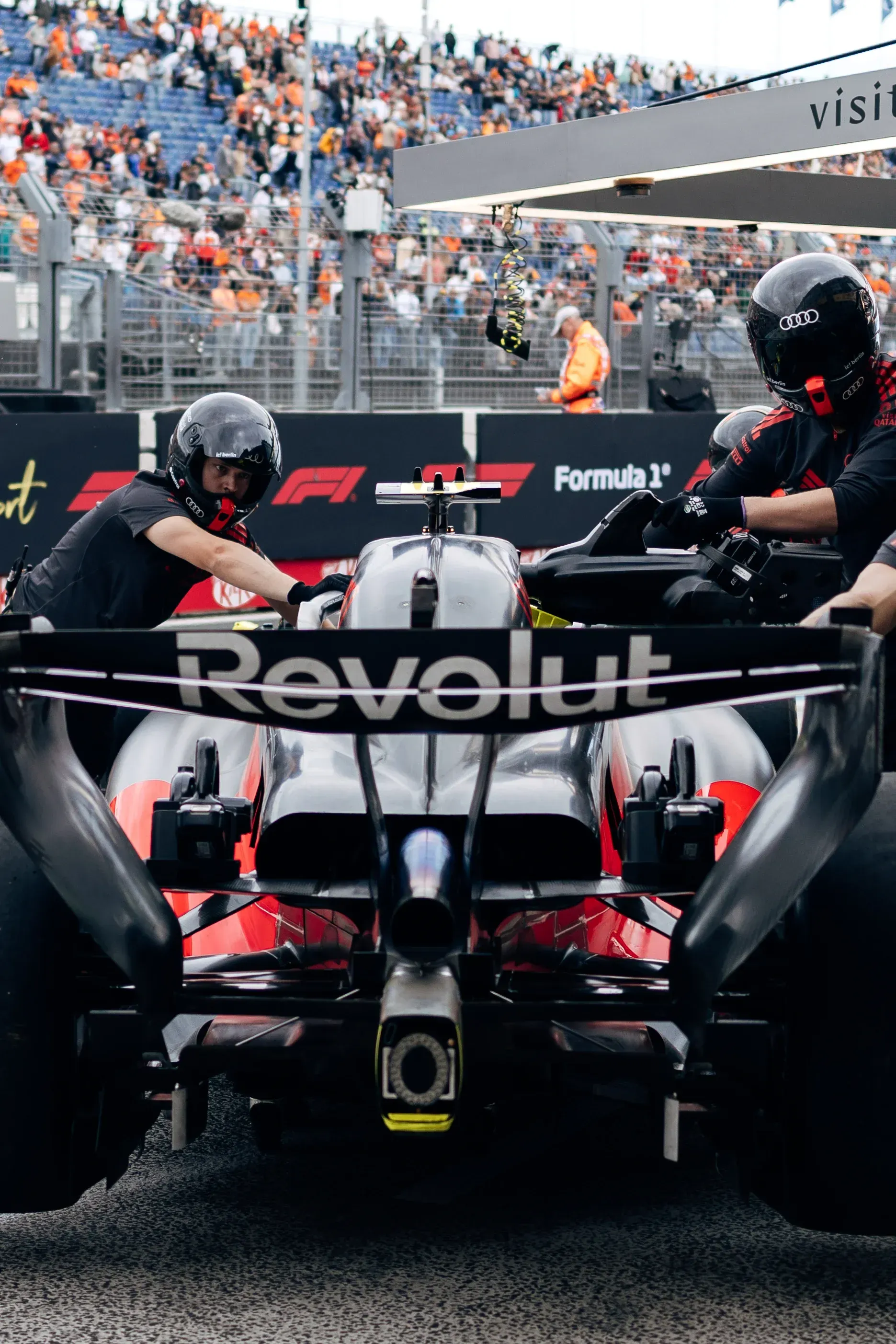 Audi Revolut F1® Team crew preparing the car on the grid in front of the Zandvoort grandstands