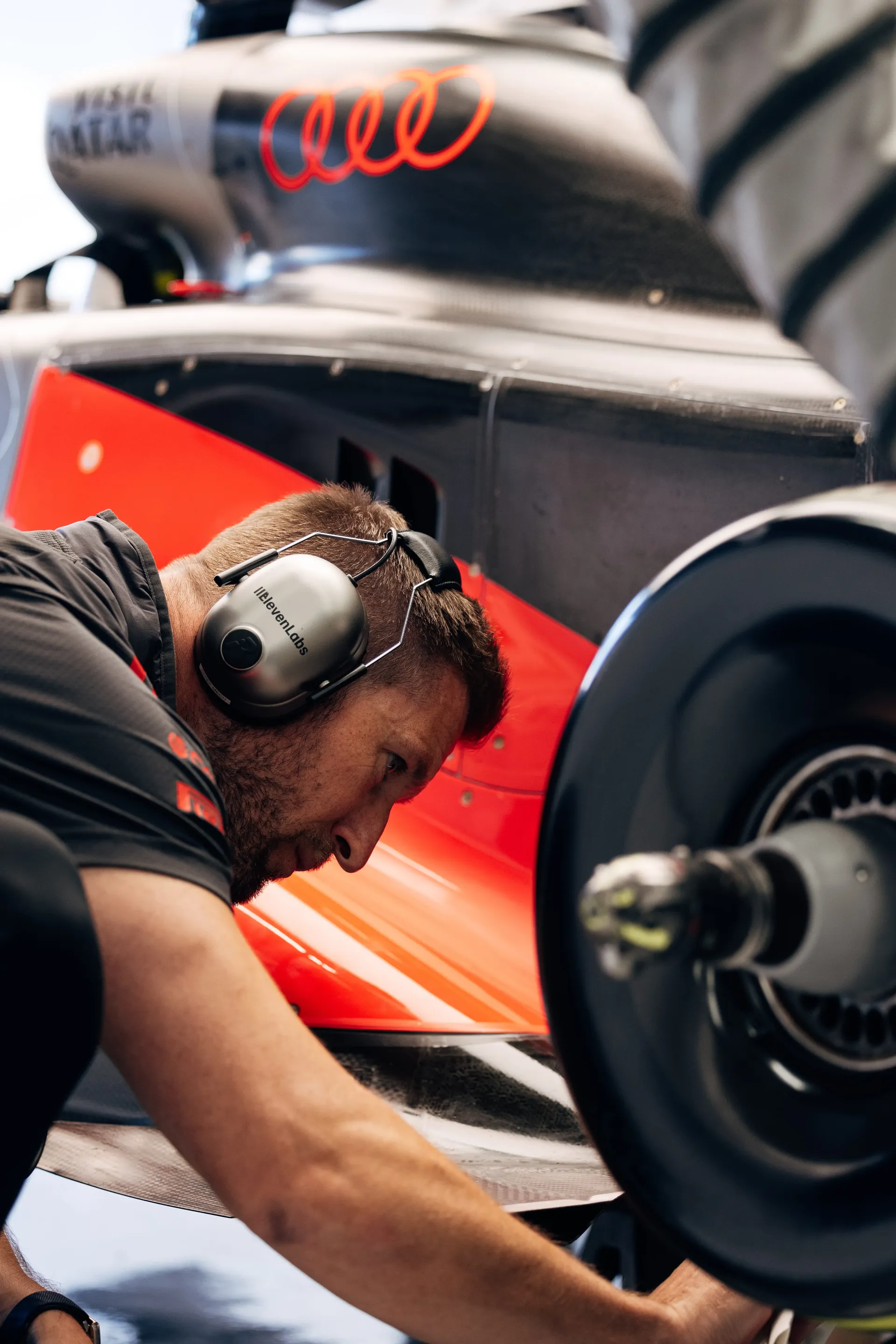 Audi Revolut F1® Team mechanic working on the car's wheel at Zandvoort