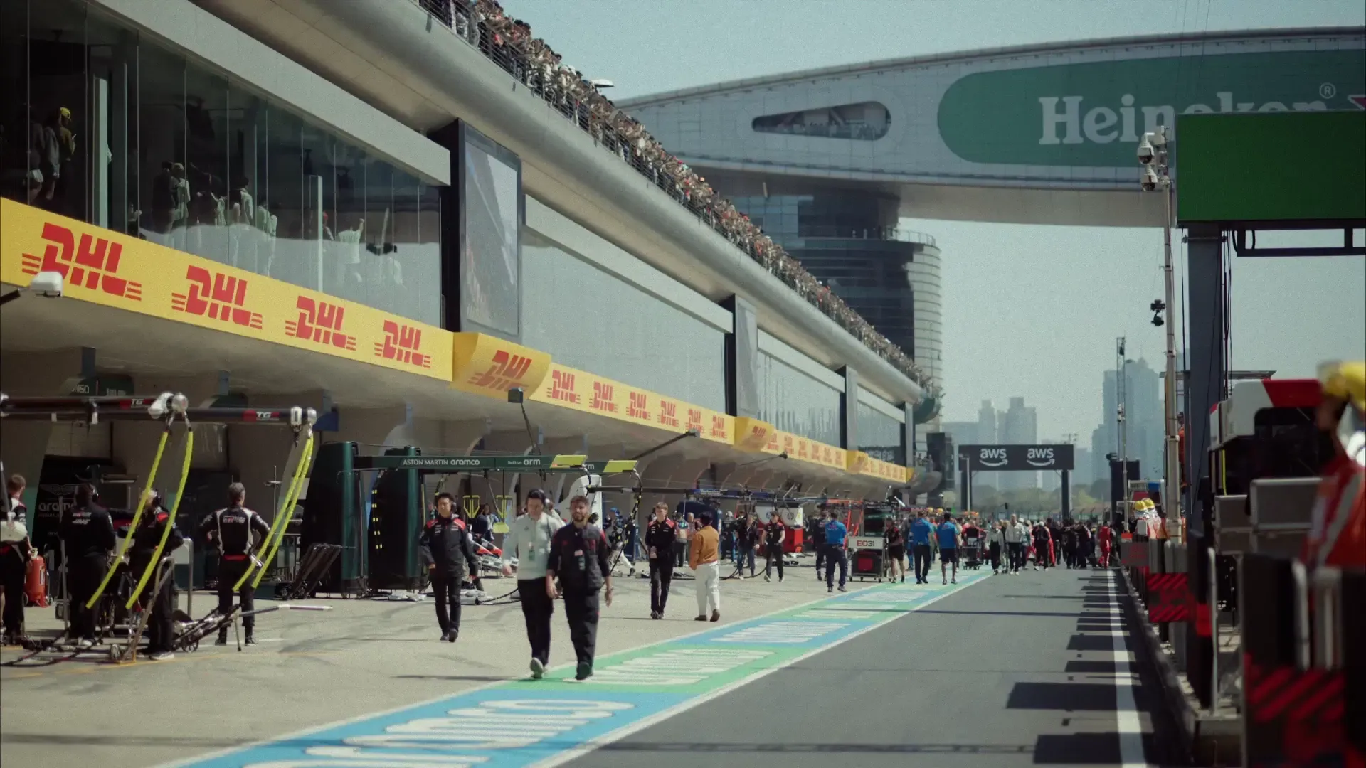 Crew members of the Audi Revolut F1® Team walking at the Chinese Grand Prix racetrack in Shanghai