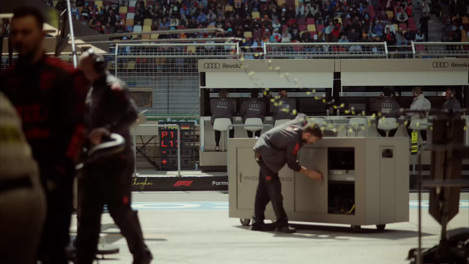 Mechanic crew members of the Audi Revolut F1® Team at the Chinese Grand Prix racetrack in Shanghai getting ready