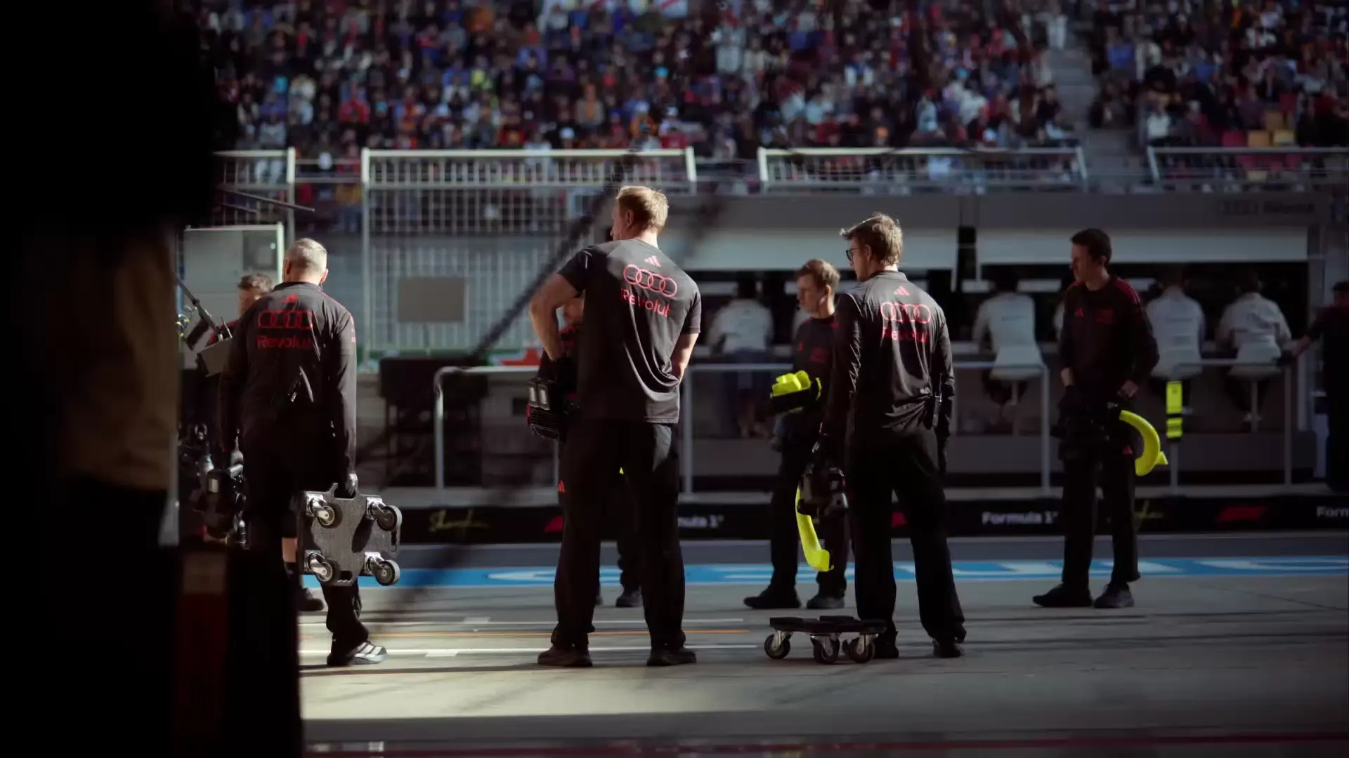 Pit Stop crew members of the Audi Revolut F1® Team at the Chinese Grand Prix racetrack waiting for the car to enter