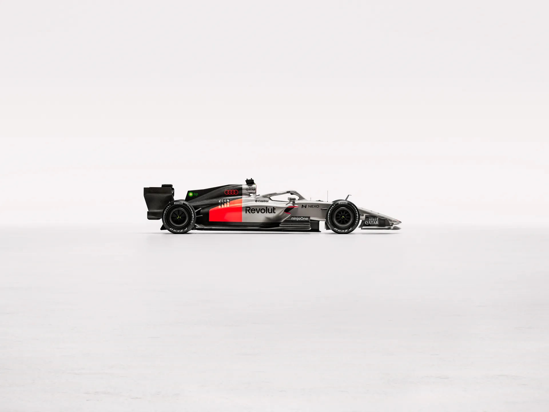 Side view of the Audi Revolute F1 Team R26 car in studio