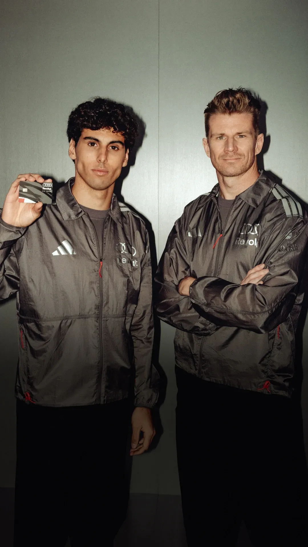 Gabriel Bortoleto and Nico Hulkenberg posing with the Revolut Apex Card, Audi Revolut F1® Team
