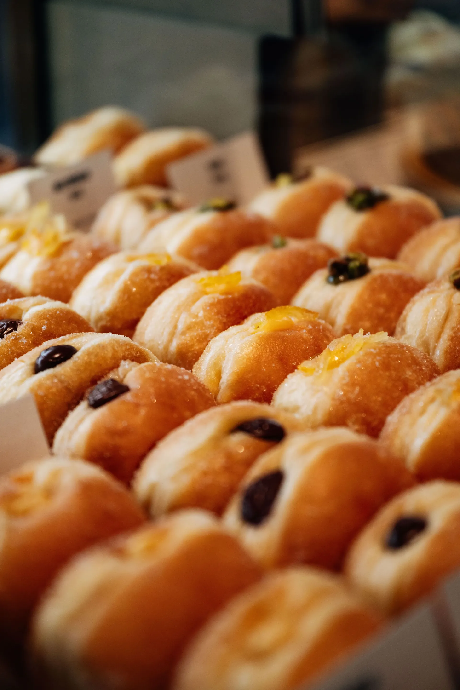 Sugar-coated doughnuts filled with chocolate, citrus and pistachio in Singapore during the Audi Revolut F1® Team collaboration