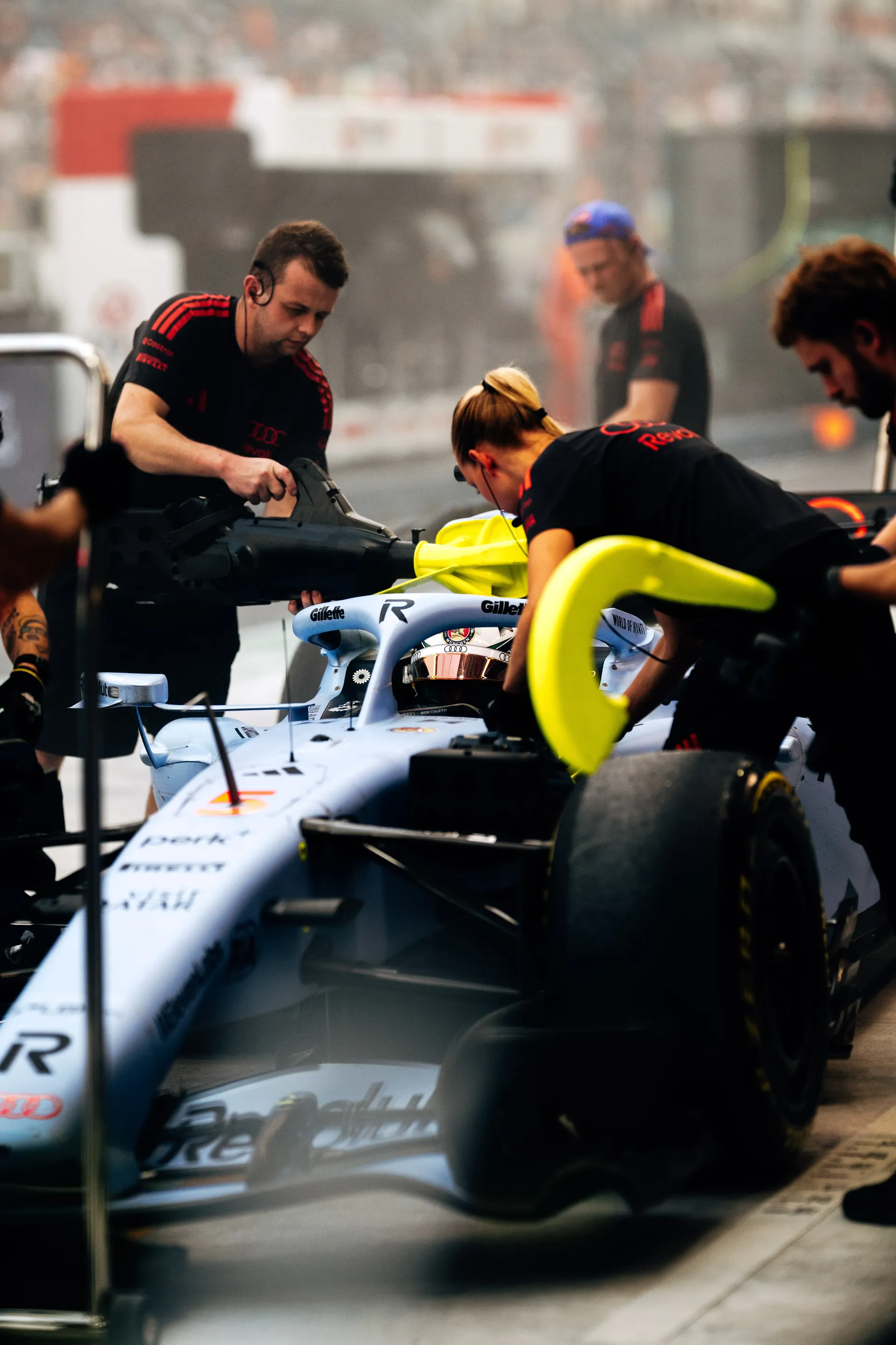 Audi Revolut F1® Team mechanics preparing the car in the garage.