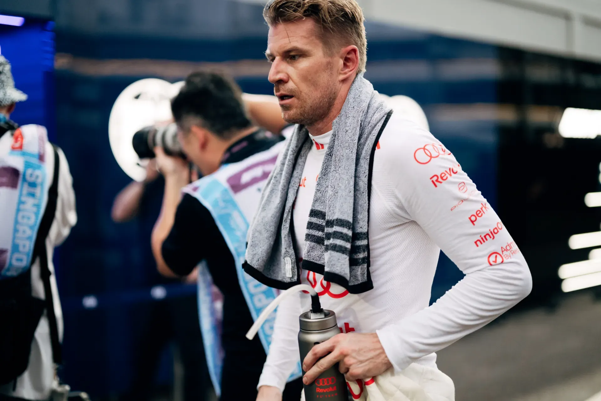 Nico Hulkenberg of the Audi Revolut F1® Team with a towel around the neck holding a drink bottle in Singapore