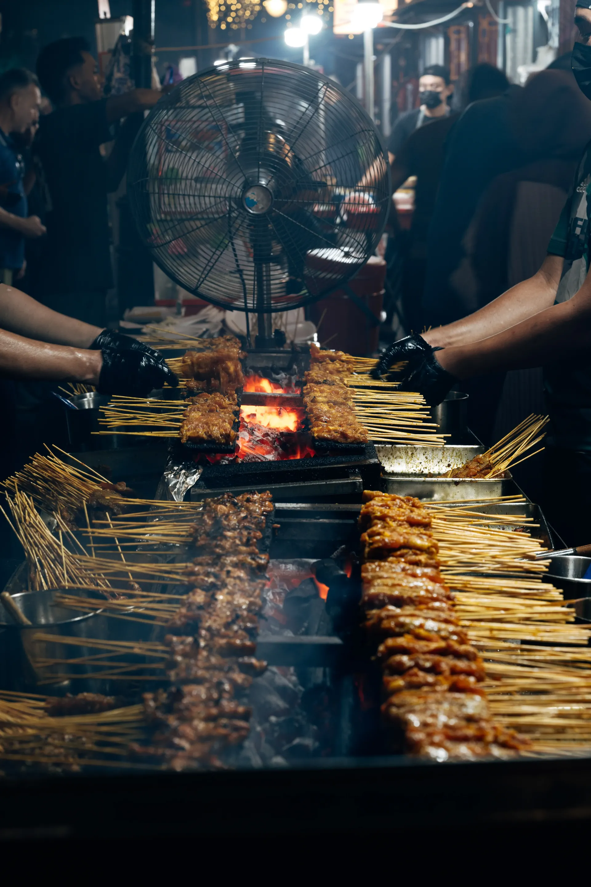 Singapore street food stall grilling skewers