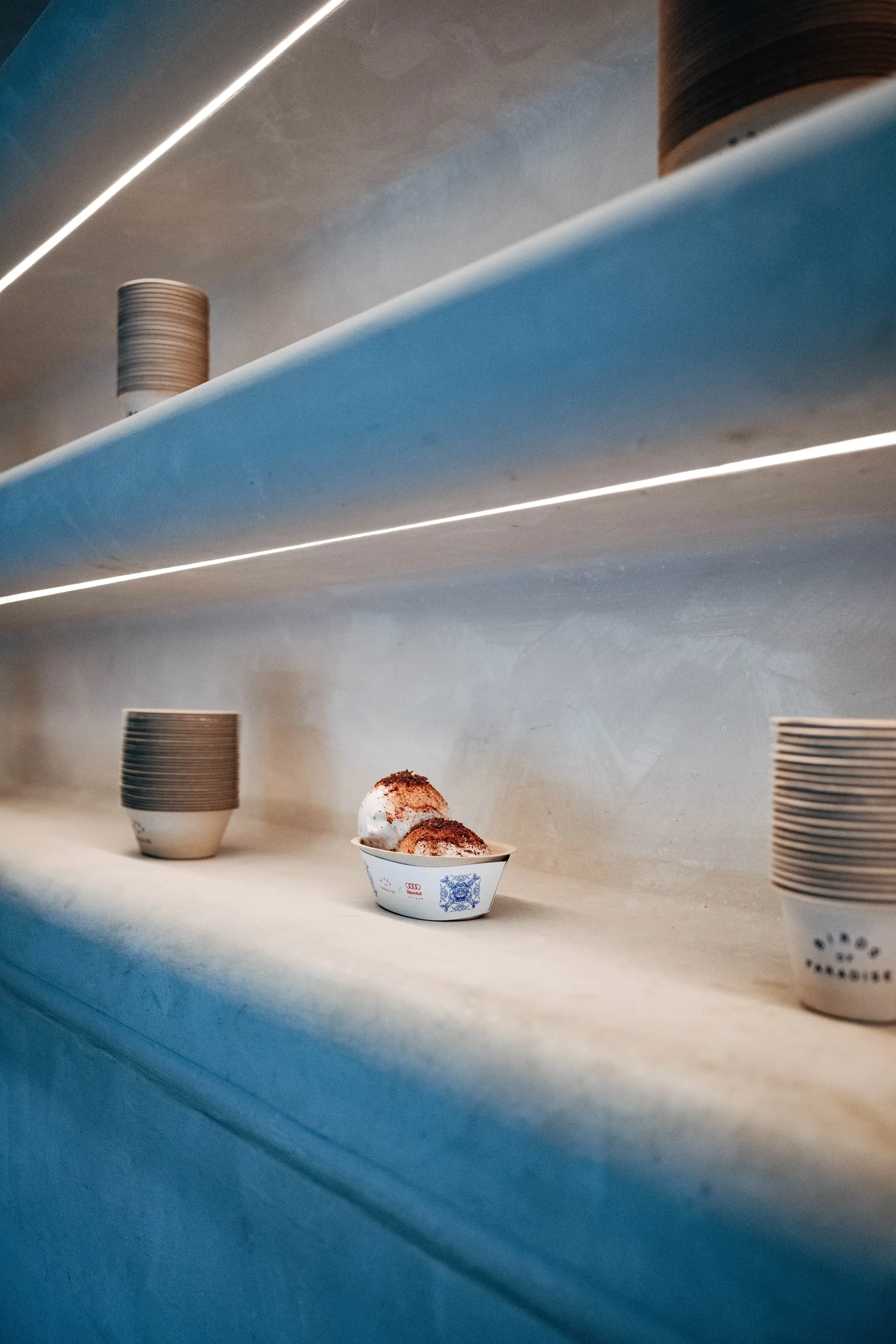Shelves displaying ceramic tableware in a restaurant