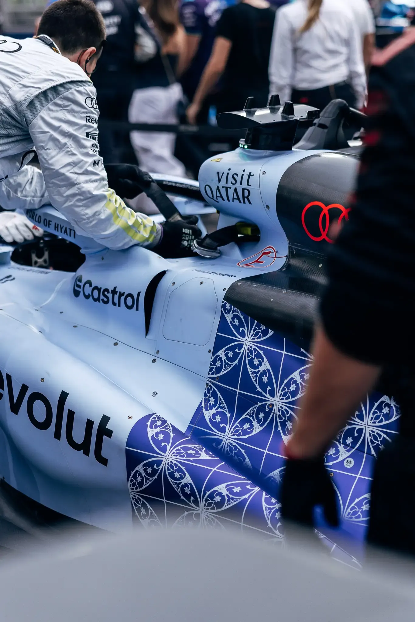 Audi Revolut F1® Team engineer leaning over the cockpit.