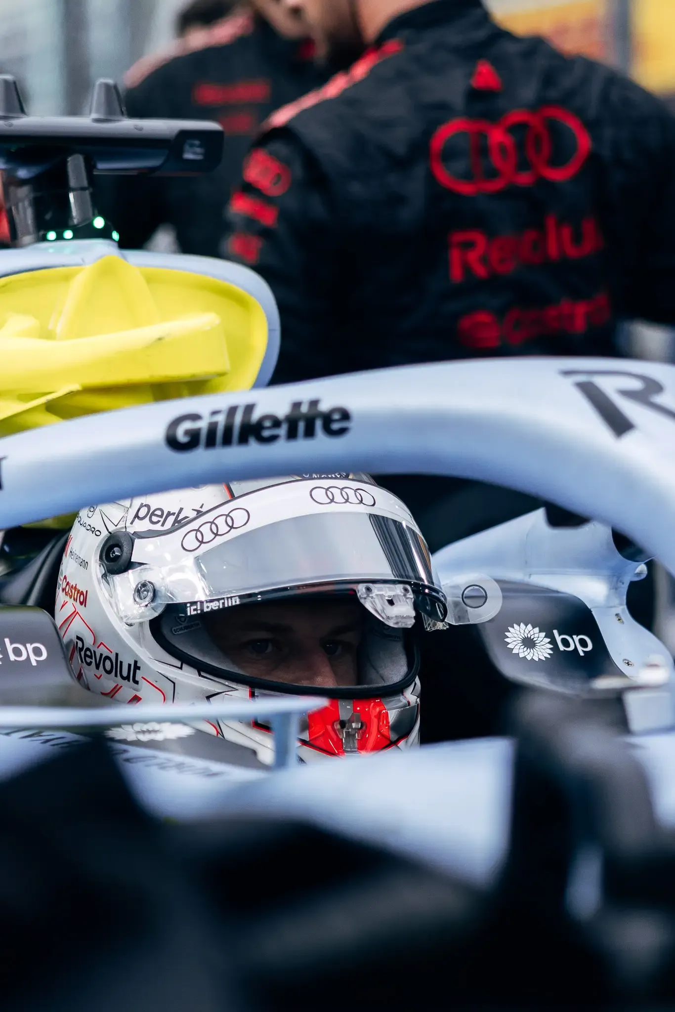 Audi Revolut F1® Team driver Nico Hülkenberg in the cockpit with mechanics.