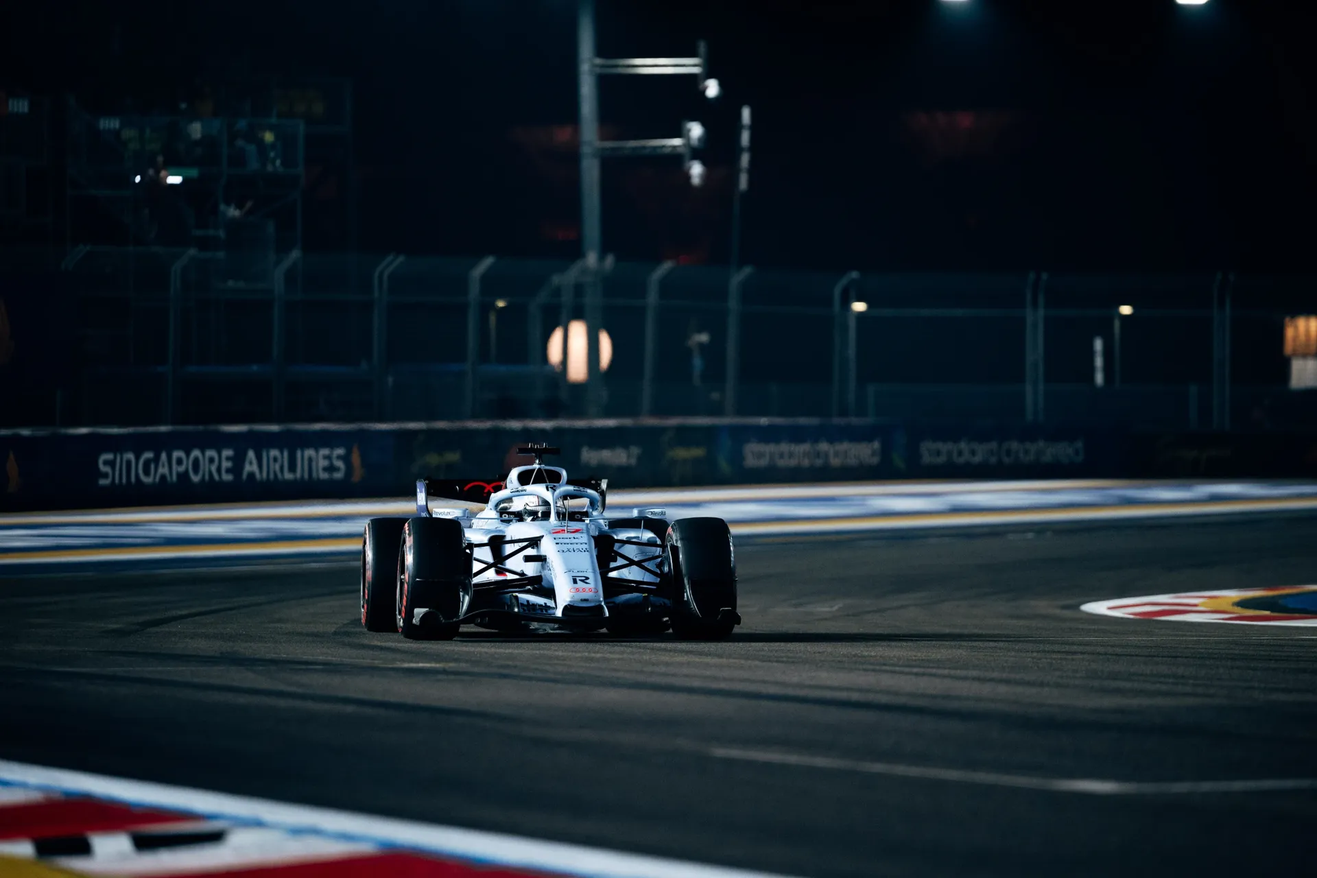 Car of the Audi Revolut F1® Team driving on track at night in Singapore