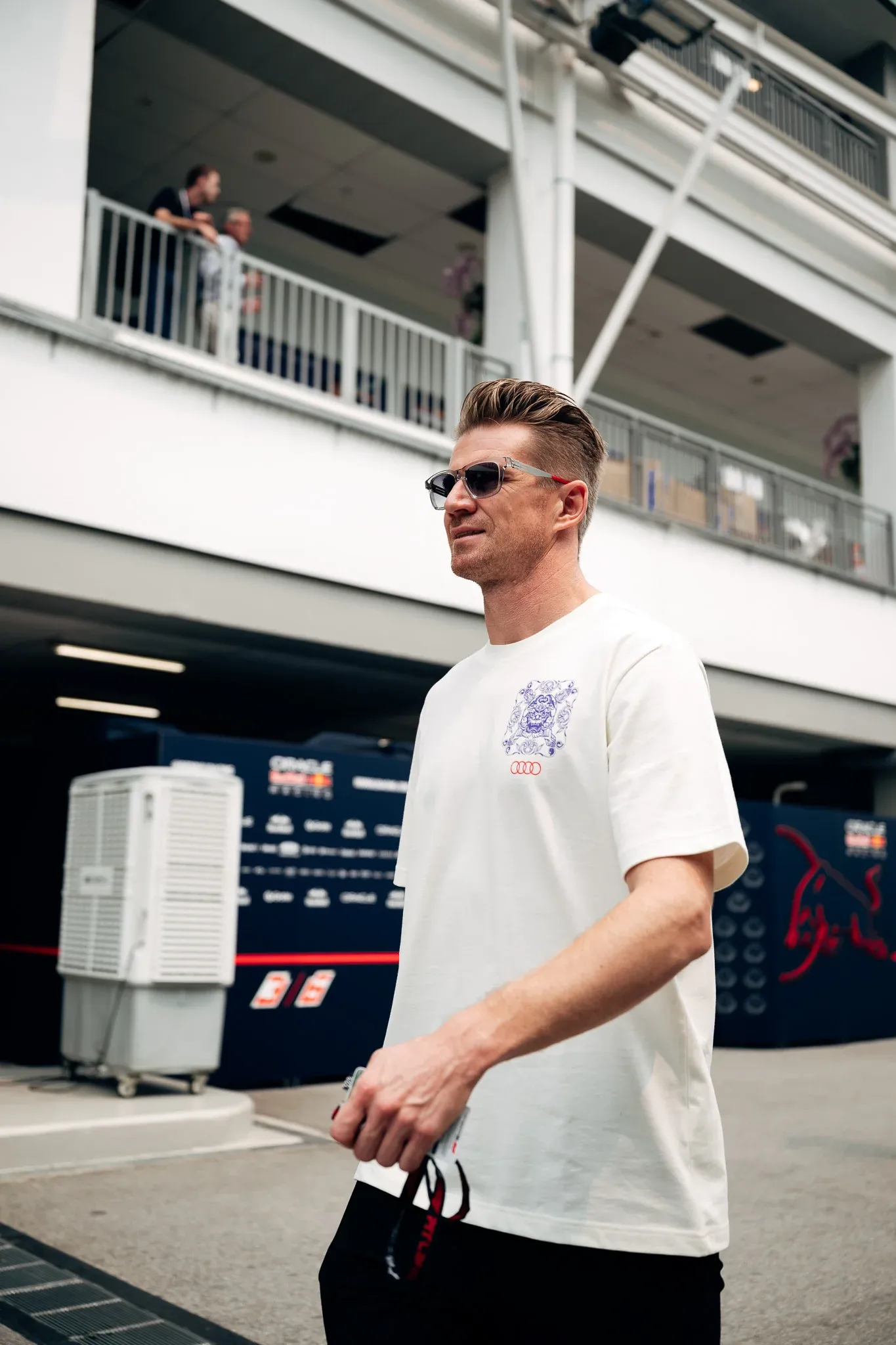 Nico Hulkenberg, driver of the Audi Revolut F1® Team, walking through the Singapore paddock.