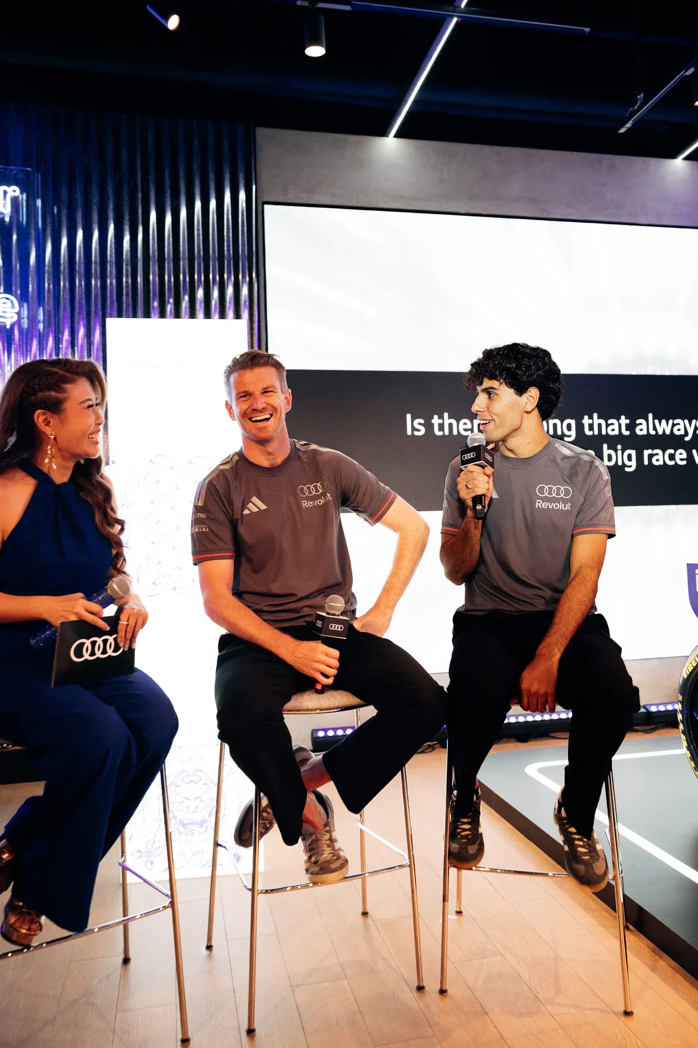 Audi Revolut F1® Team drivers Gabriel Bortoleto and Nico Hulkenberg taking part in an on-stage interview.