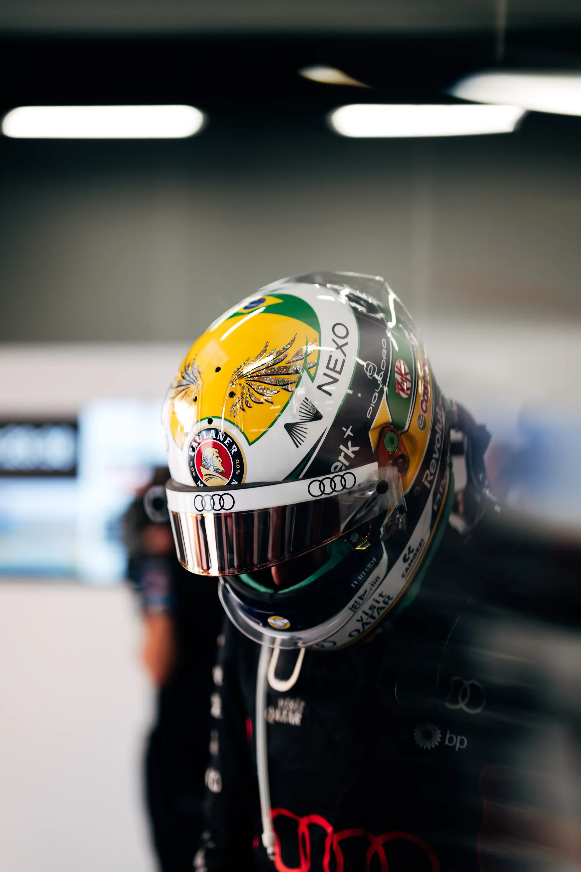 Close-up of Gabriel Bortoleto’s helmet in Audi Revolut F1® Team colours resting in the garage during Qualifying preparations at Silverstone.