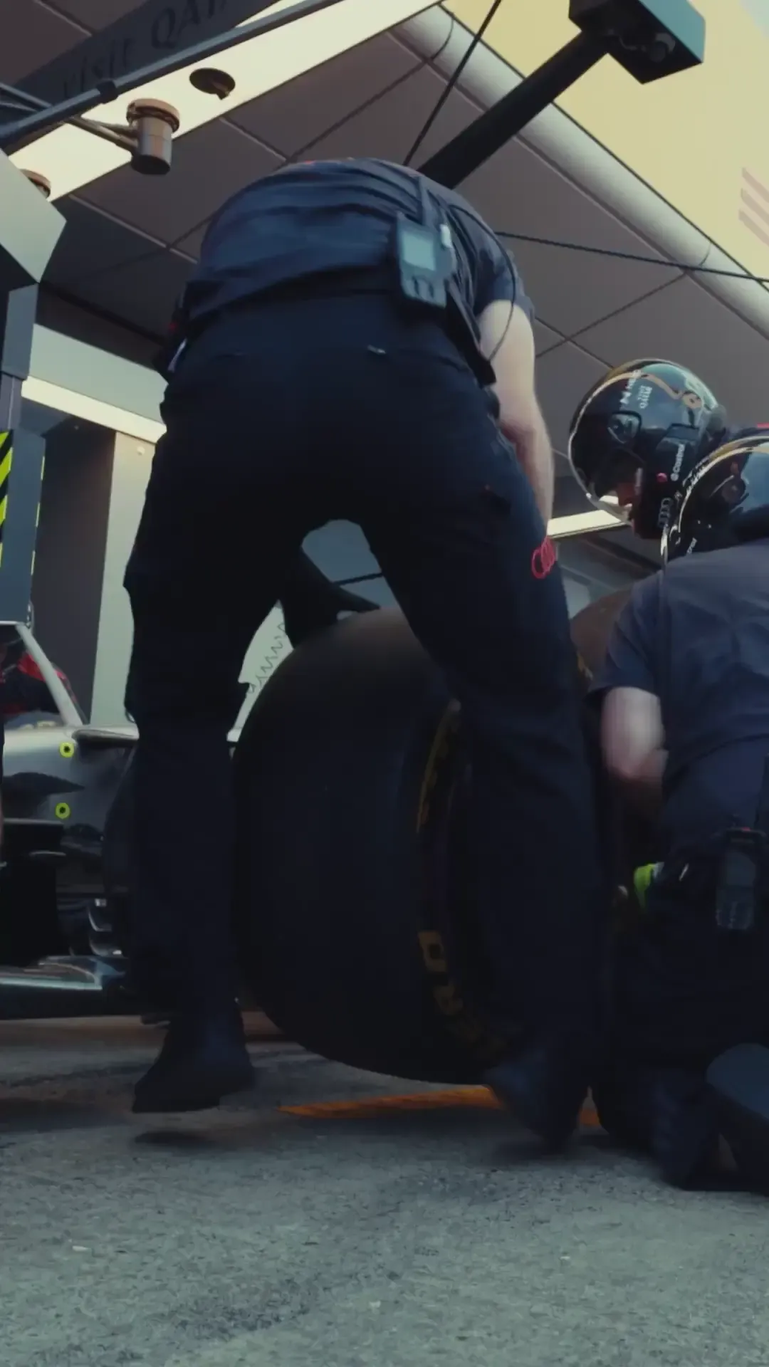 High-energy race day montage of the Audi Revolut F1® Team at Silverstone, showing drivers, garage activity, on-track action and crowd atmosphere building towards lights out.
