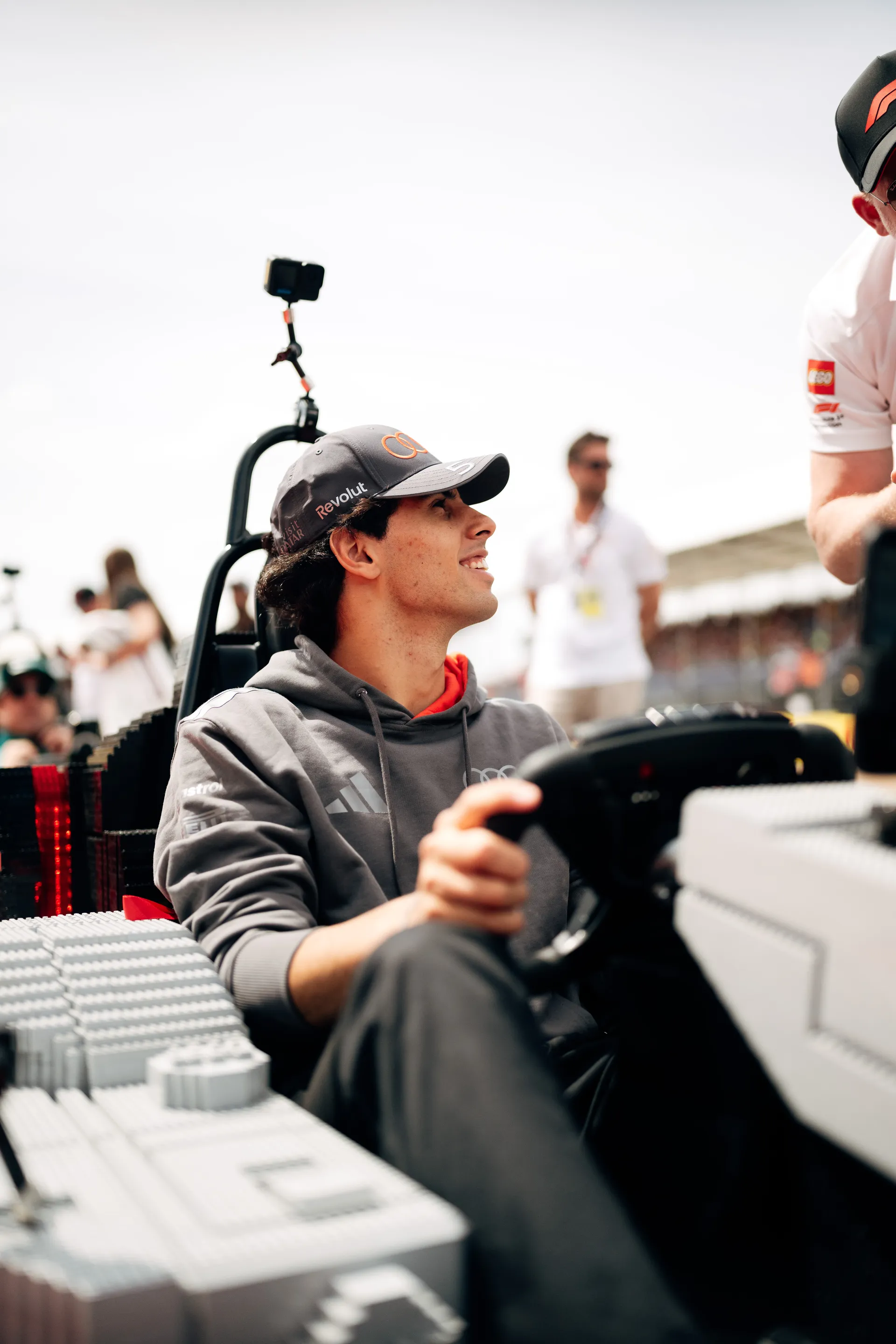 Gabriel Bortoleto sitting in a LEGO® Audi R26 kart during the Drivers’ Parade at Silverstone.