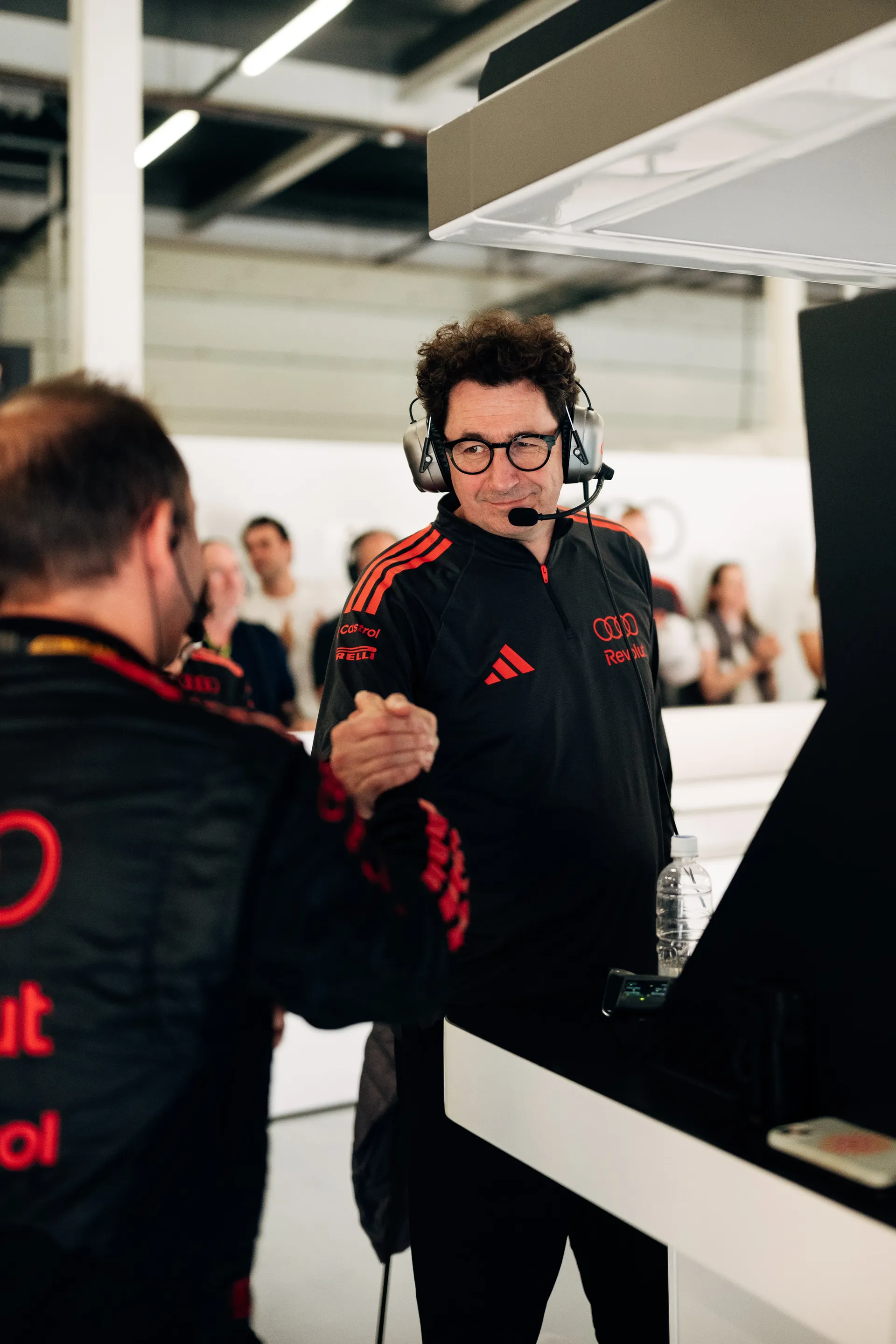 Audi Revolut F1® Team Mattia Binotto wearing headset working on the pit wall during the race weekend.