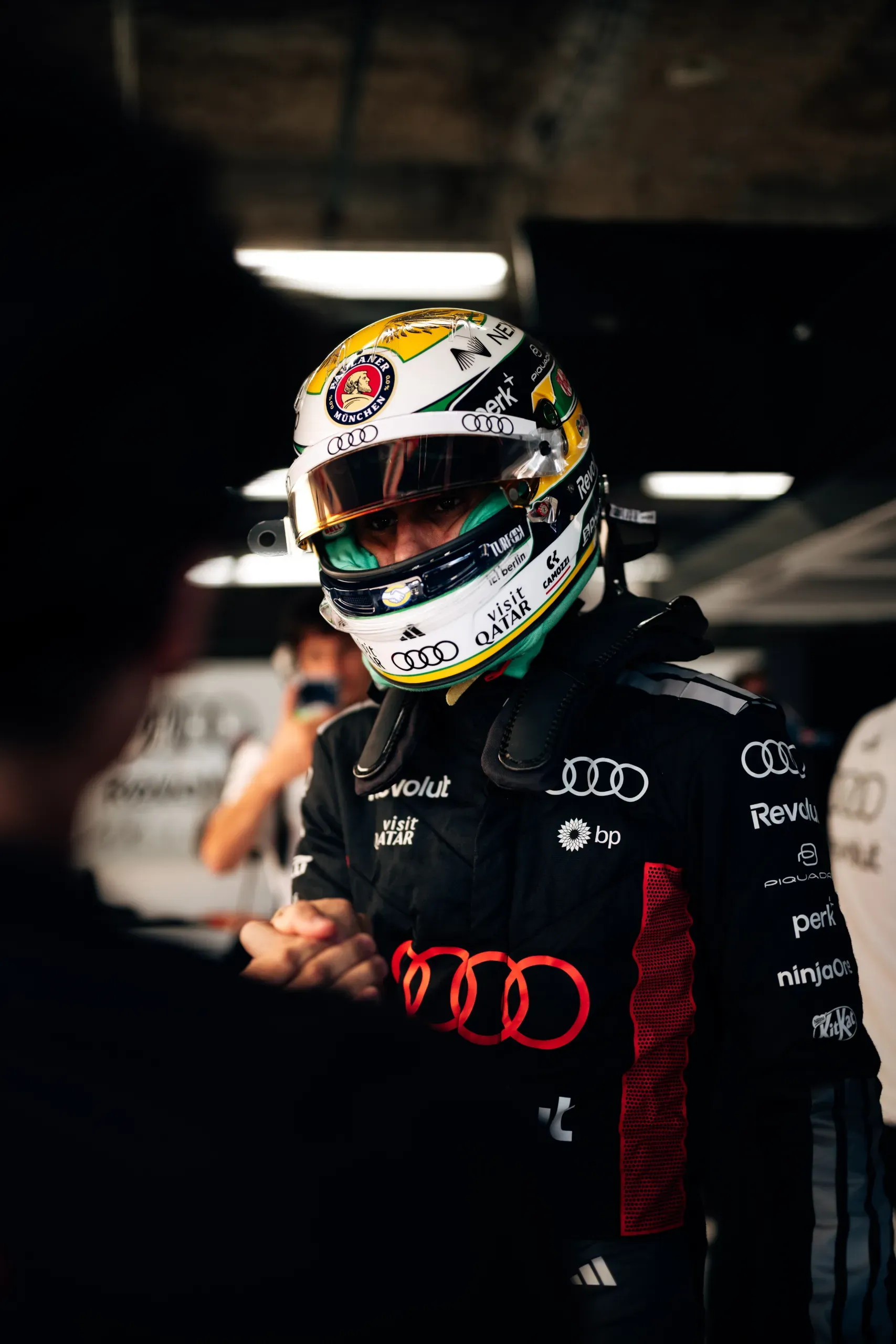 Audi Revolut F1® Team driver Gabriel Bortoleto in his helmet shaking hands in the garage at the United States Grand Prix
