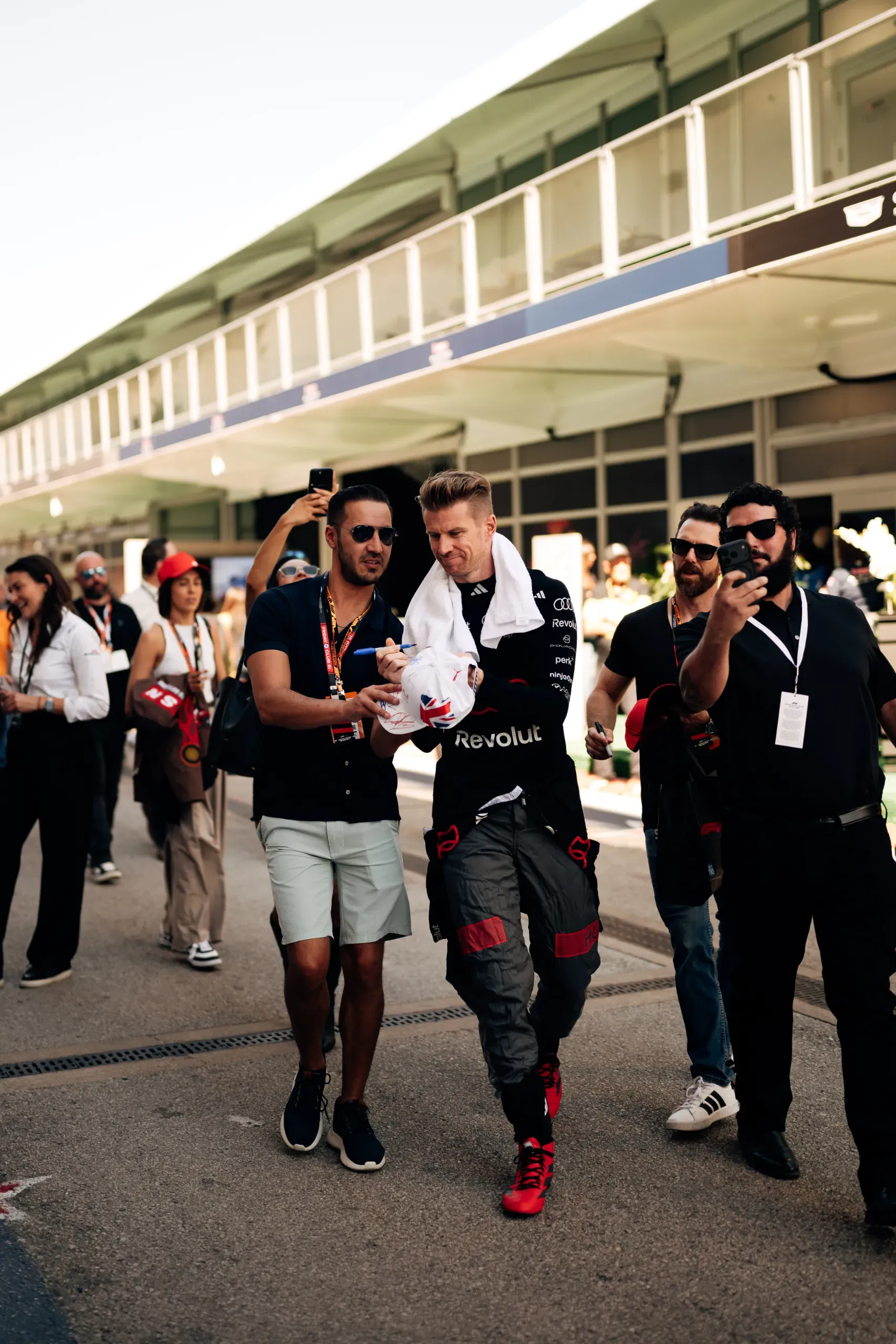 Audi Revolut F1® Team driver Nico Hulkenberg signing a cap for fans in the paddock at the United States Grand Prix