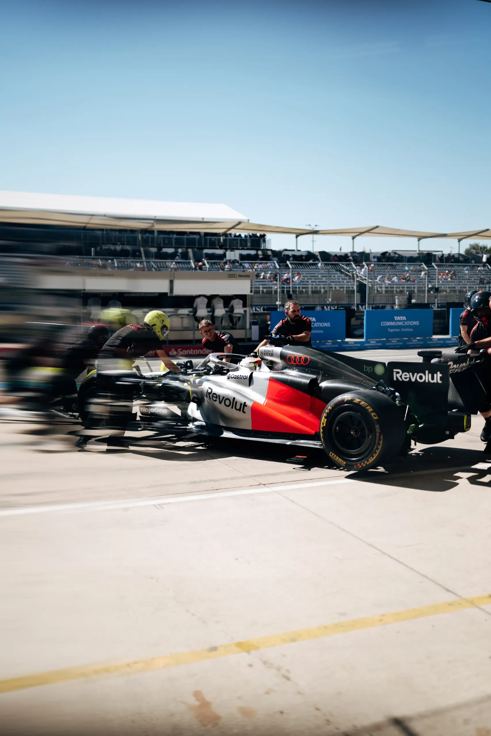 Mechanics of the Audi Revolut F1® Team pushing the Audi R26 in the pit lane at the United States Grand Prix