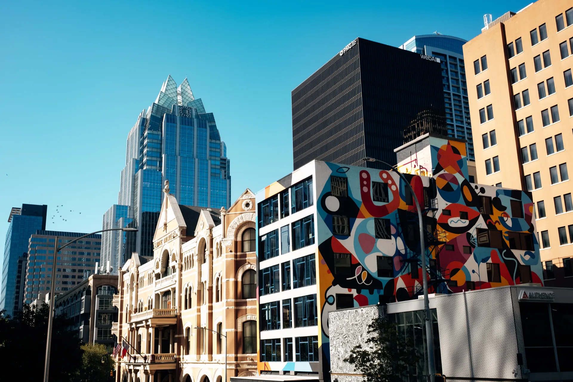 Frost Bank Tower, the historic Driskill hotel and a colourful mural in downtown Austin