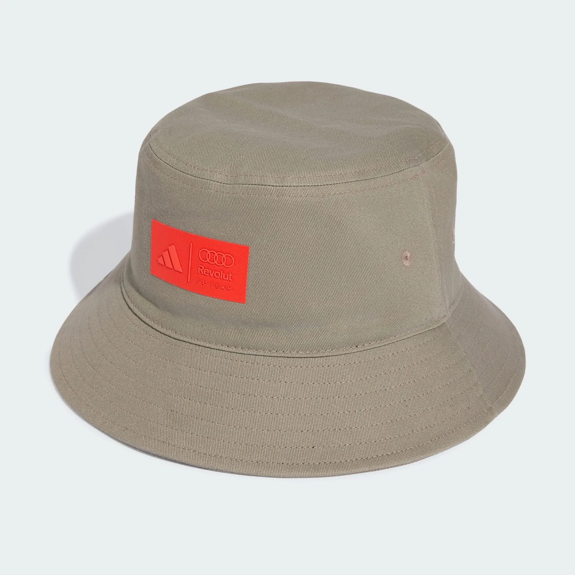 Front shot of the first adidas x Audi Revolut F1® Team collection bucket hat in the Studio