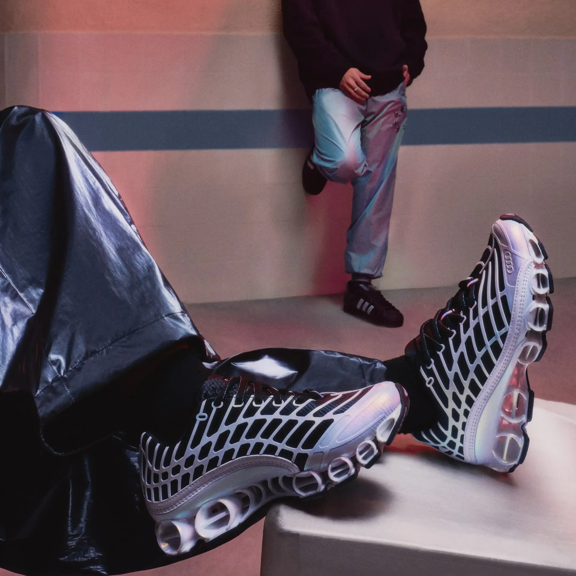 Close-up of adidas fanwear sneakers on feet with casual outfit styling