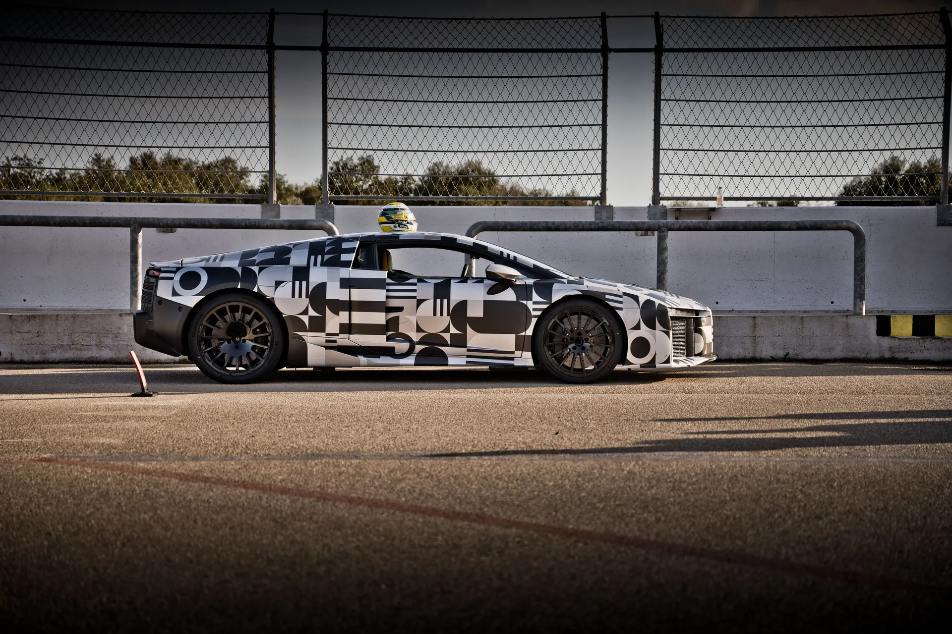 Side view of the Audi Nuvolari race car during a track test.