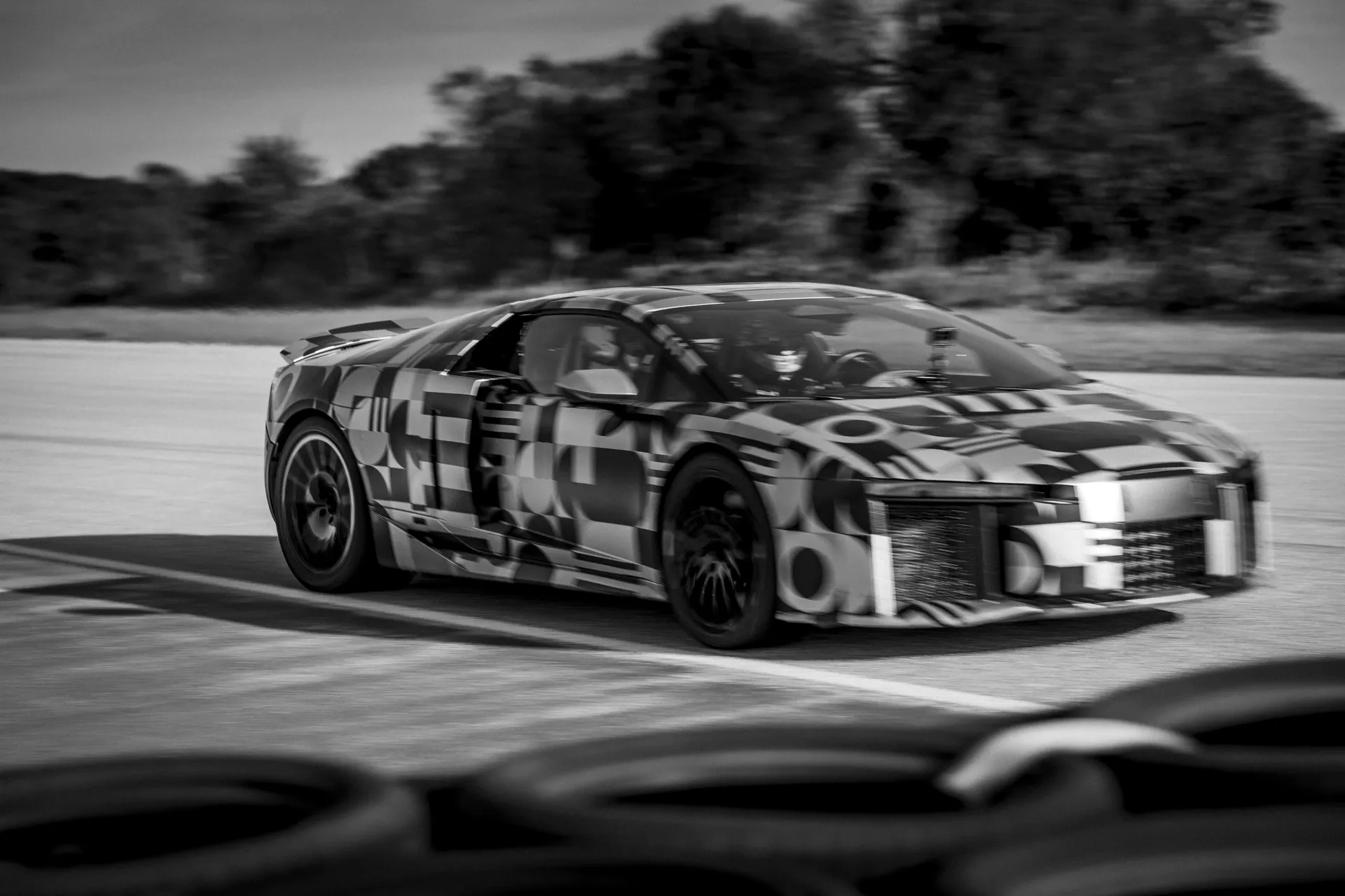 Audi Nuvolari race car cornering during a high-speed test session.