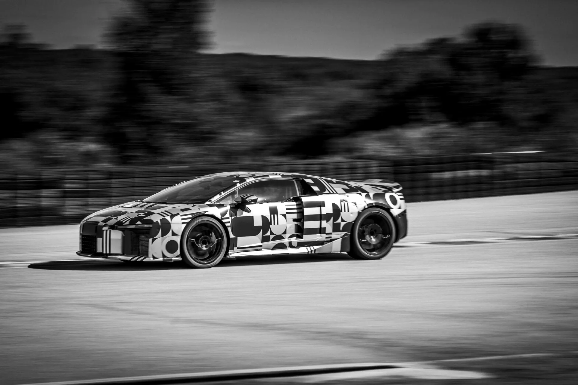 Audi Nuvolari race car in motion during high-speed testing.