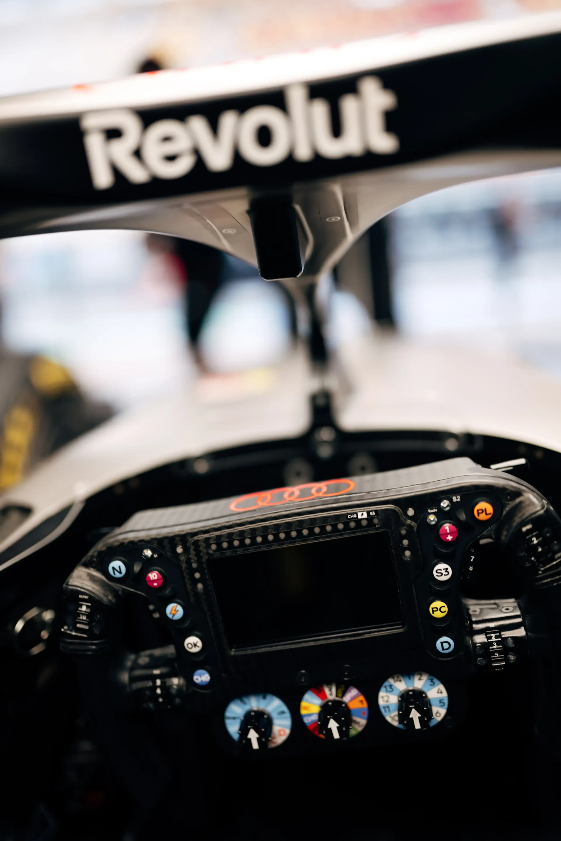 Close up of the steering wheel inside the Audi Revolut F1® Team car Audi R26 cockpit