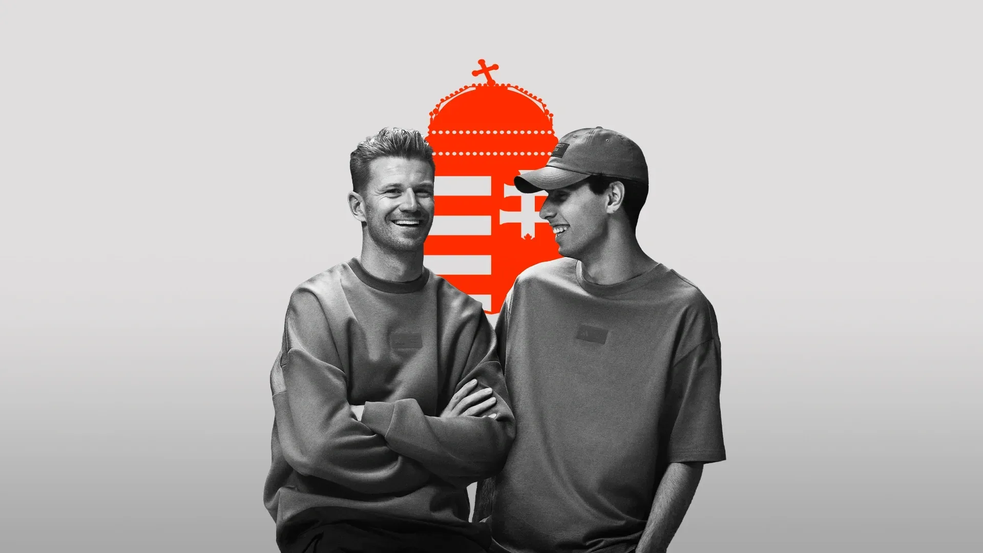 Black and white shot of Audi Revolut F1® Team drivers Nico Hulkenberg and Gabriel Bortoleto side by side in the studio wearing adidas Eleveted Fanwear Collection