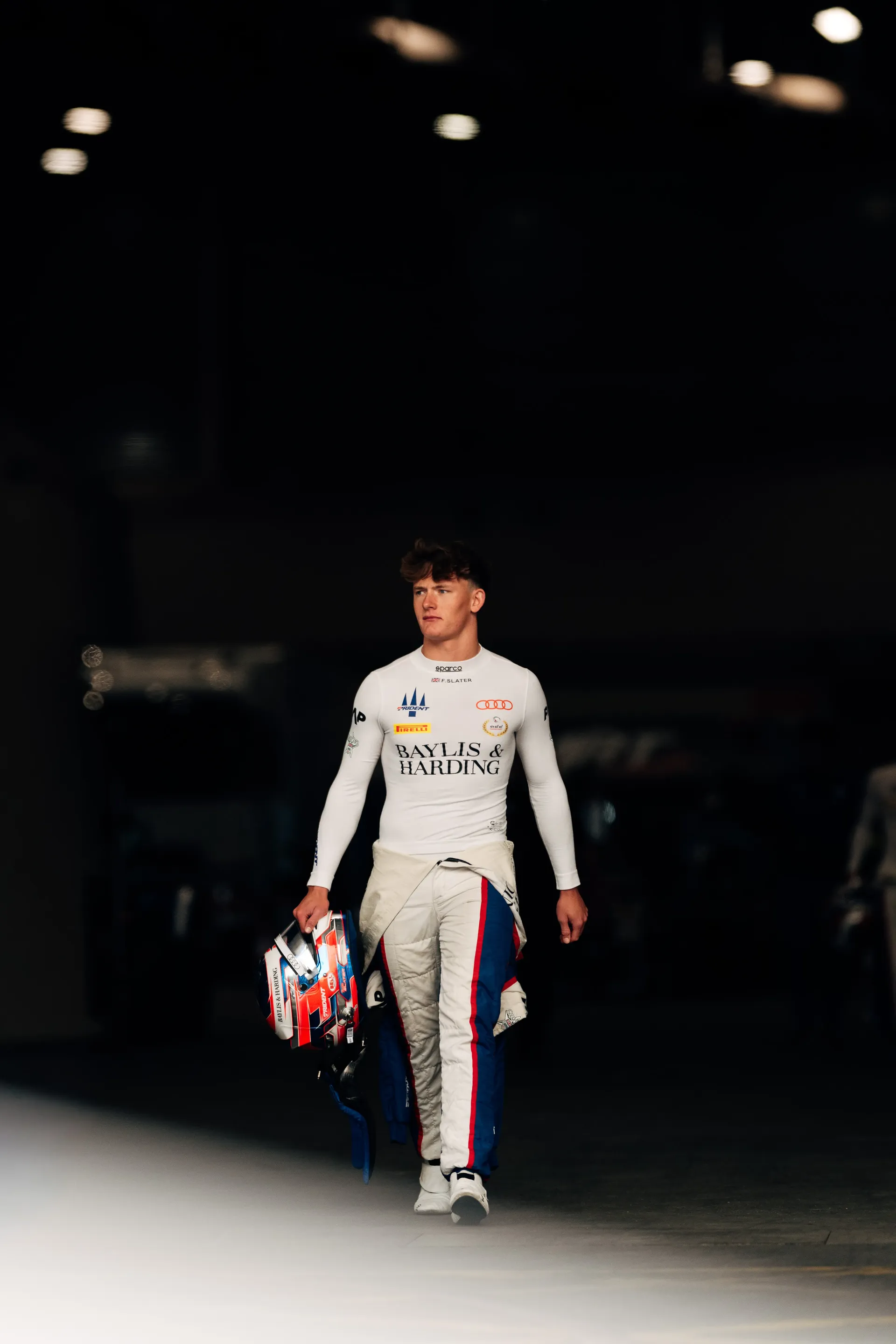 Audi Revolut F1® Team Academy F3 driver Freddie Slater walks inside the garage