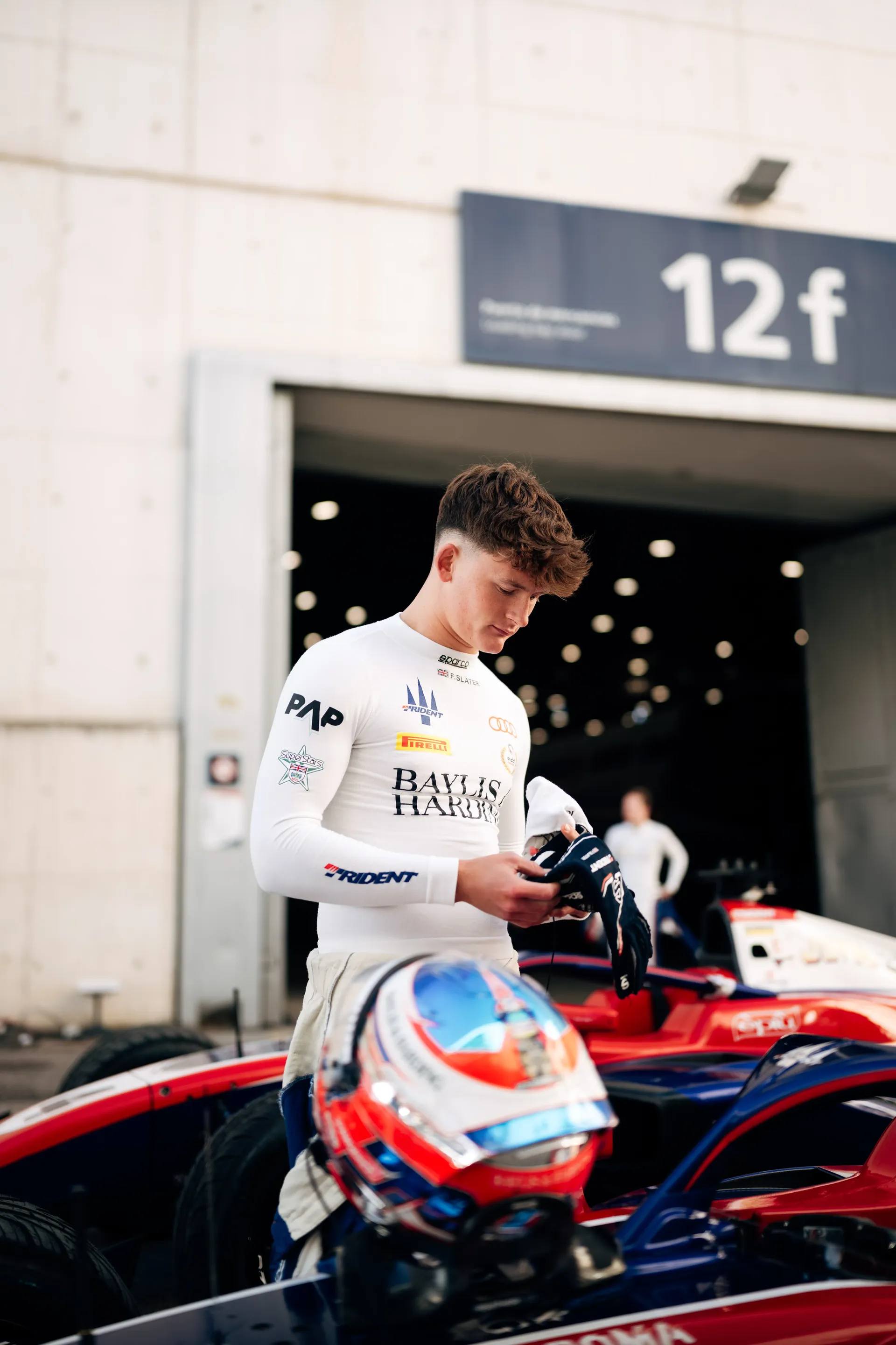 Audi Revolut F1® Team Academy F3 driver Freddie Slater standing next to his F3 racing car