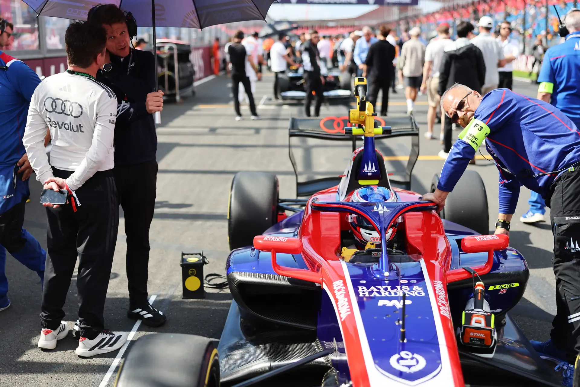 Frontview of Audi Revolut F1® Team Academy driver Freddie Slater inside his car on the Melbourne Racetrack