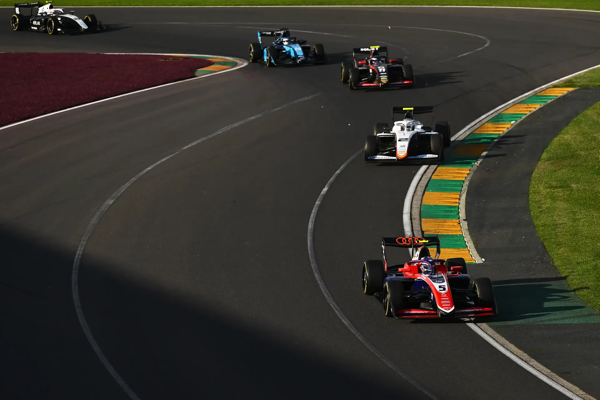 Audi Revolut F1® Team Academy driver Freddie Slater on pole position on the racetrack in front of other F3 cars