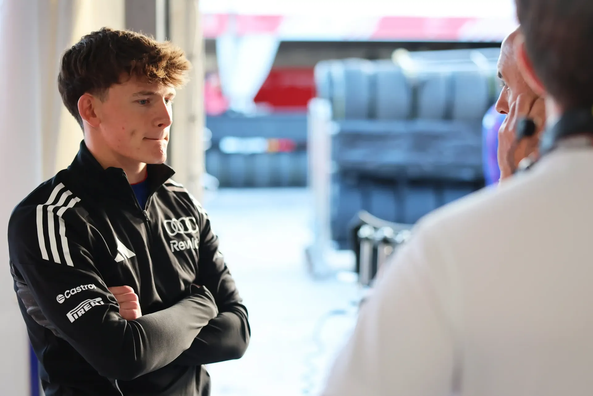 Side view of Audi Revolut F1® Team Academy driver Freddie Slater concentrated with dominant pose