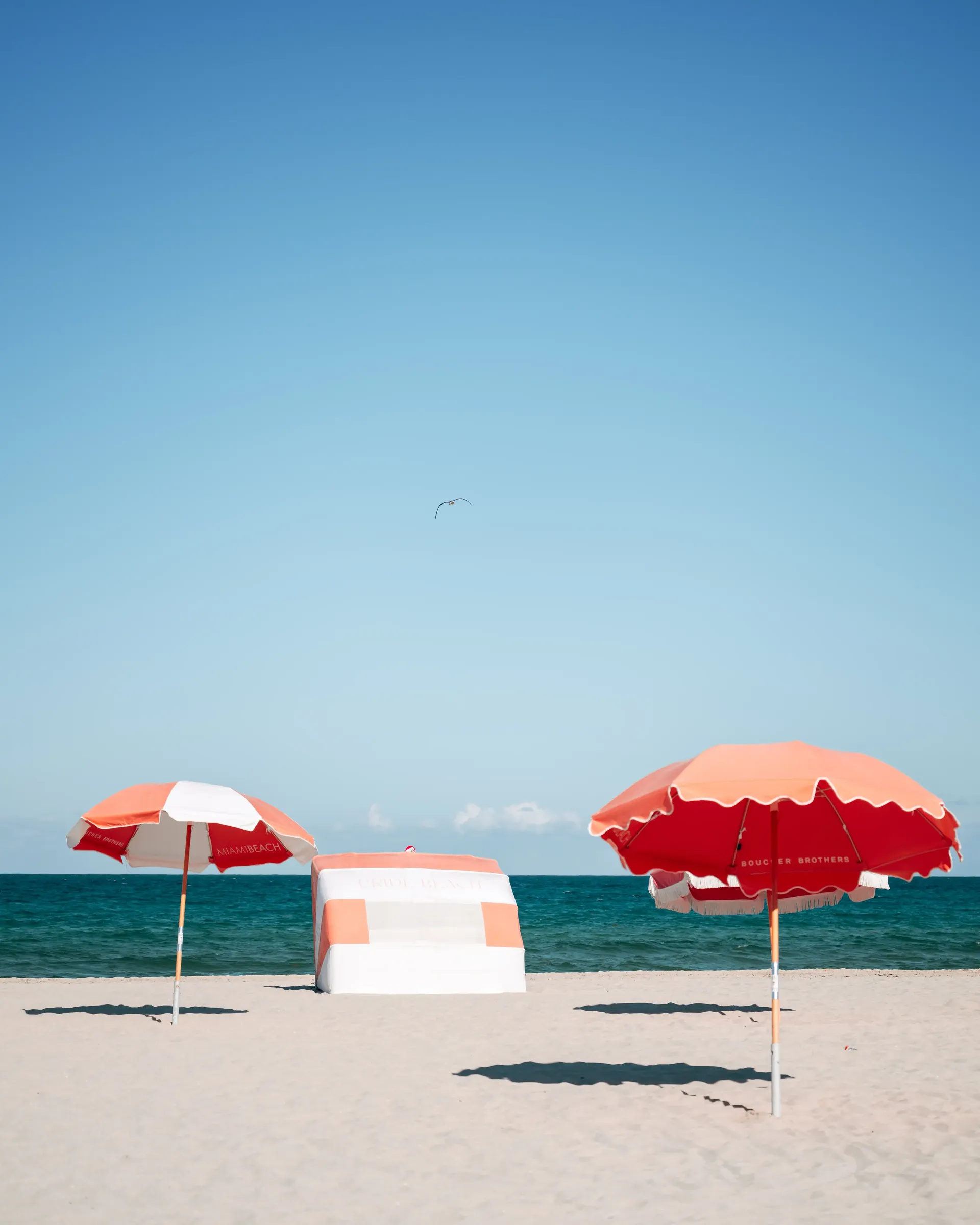 Miami Beach with red umbrellas and oceanfront relaxation scene